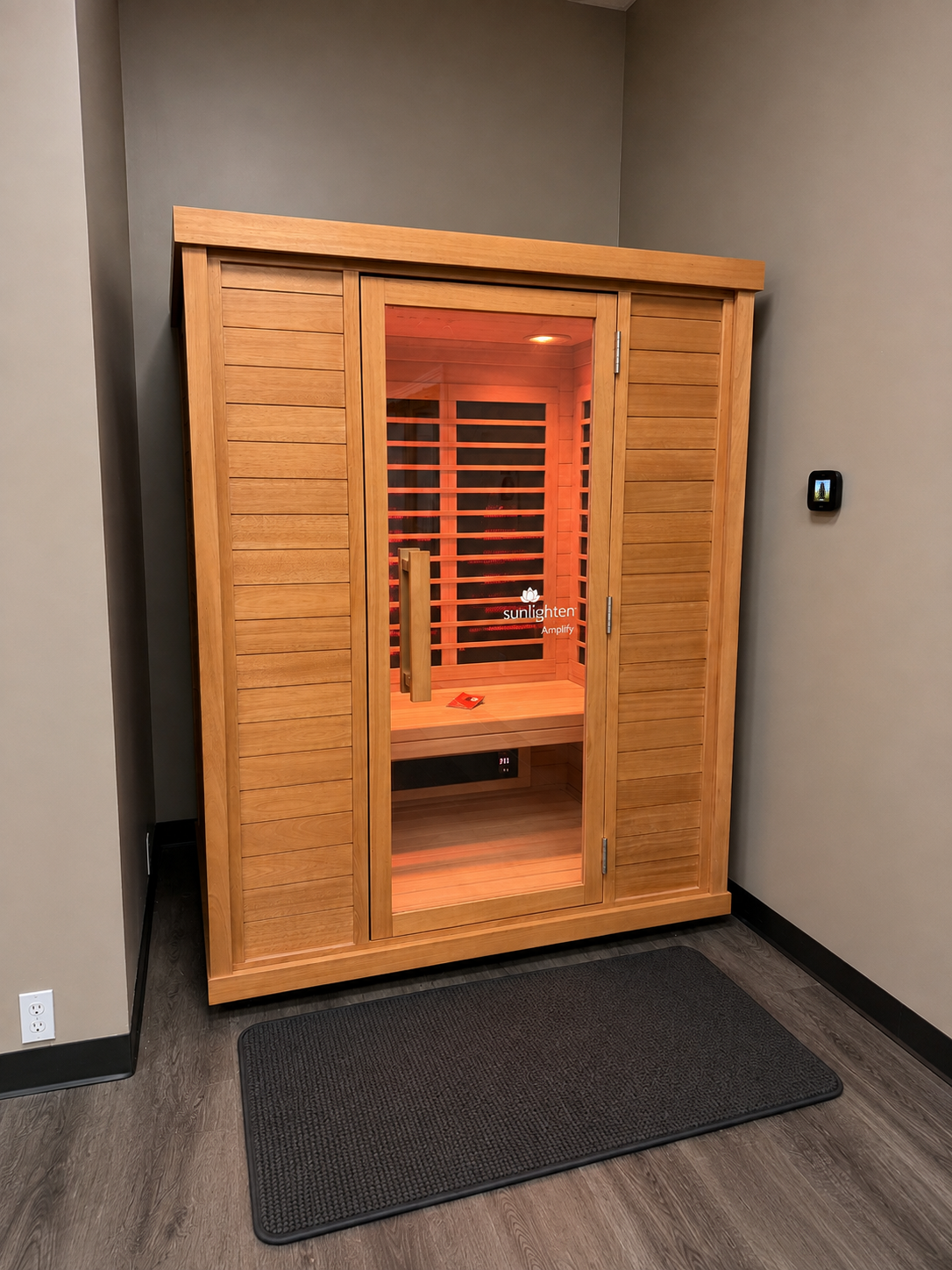 Sunlighten Amplify III eucalyptus infrared sauna with amber glow