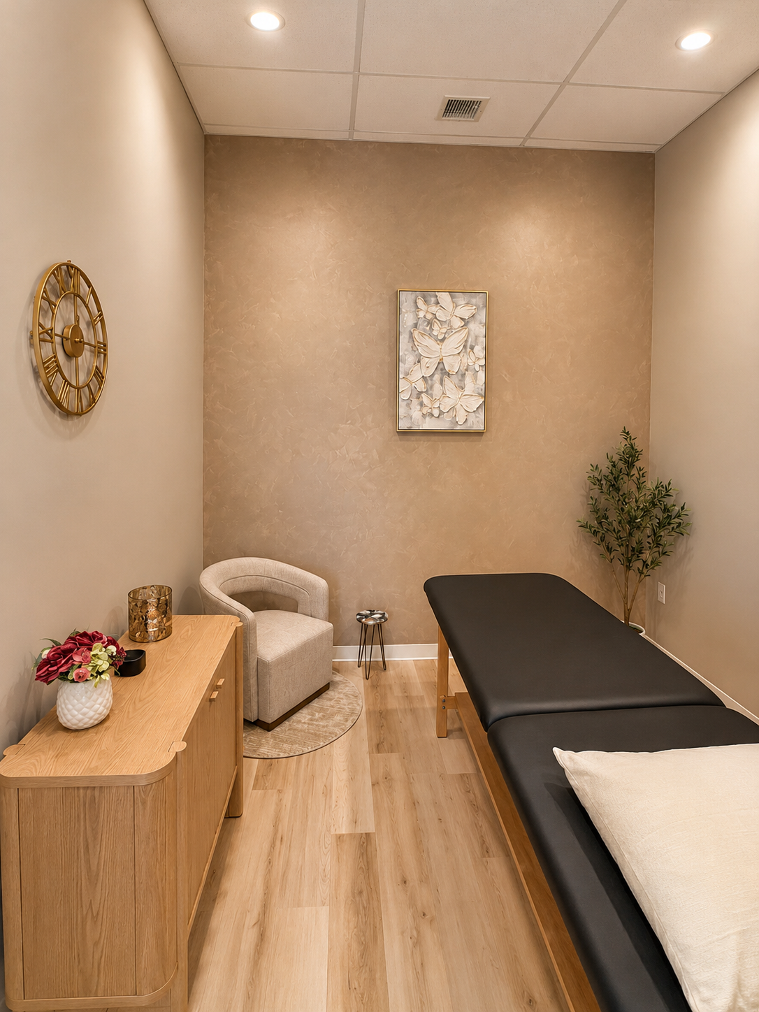 Physical therapy treatment room with warm wood tones and accent chair