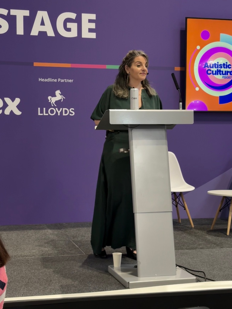 Angela at Naidex stage with Autistic Culture Podcast