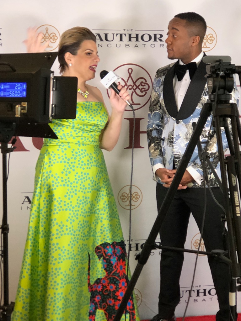 Angela on red carpet at Author Incubator event