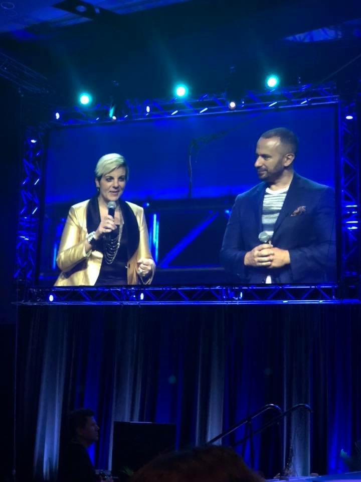 Angela speaking at conference