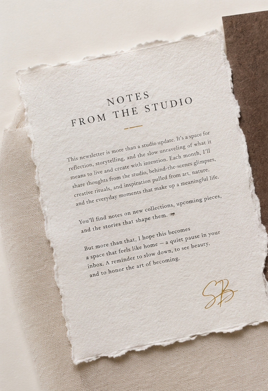 A handwritten letter from the studio on deckled paper