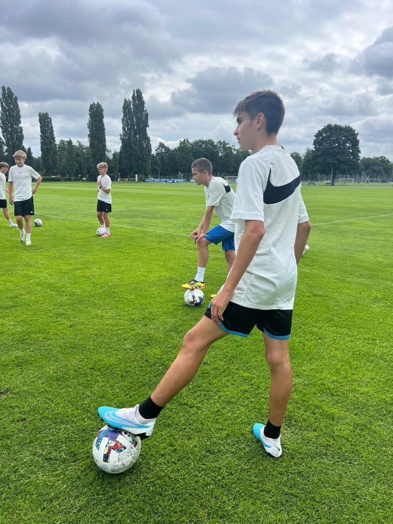 Young footballer with ball at camp in Germany – technical training Football IQ Academy