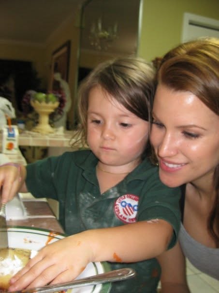 Katia Fernandez cooking with her daughter