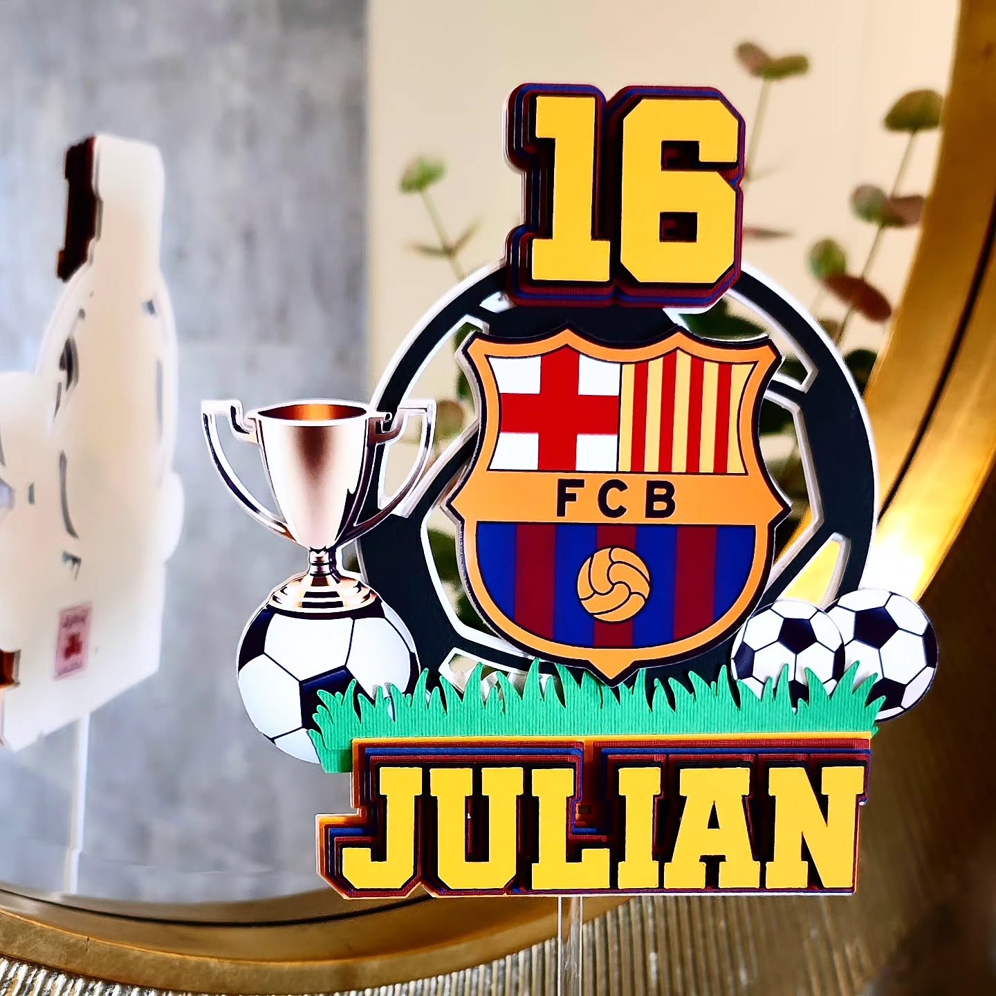 Soccer-mad Julian's 16th — FC Barcelona crest, trophy and layered numbers.