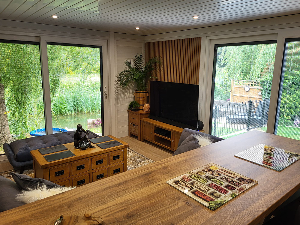 Annexe interior — open-plan living area with glass doors