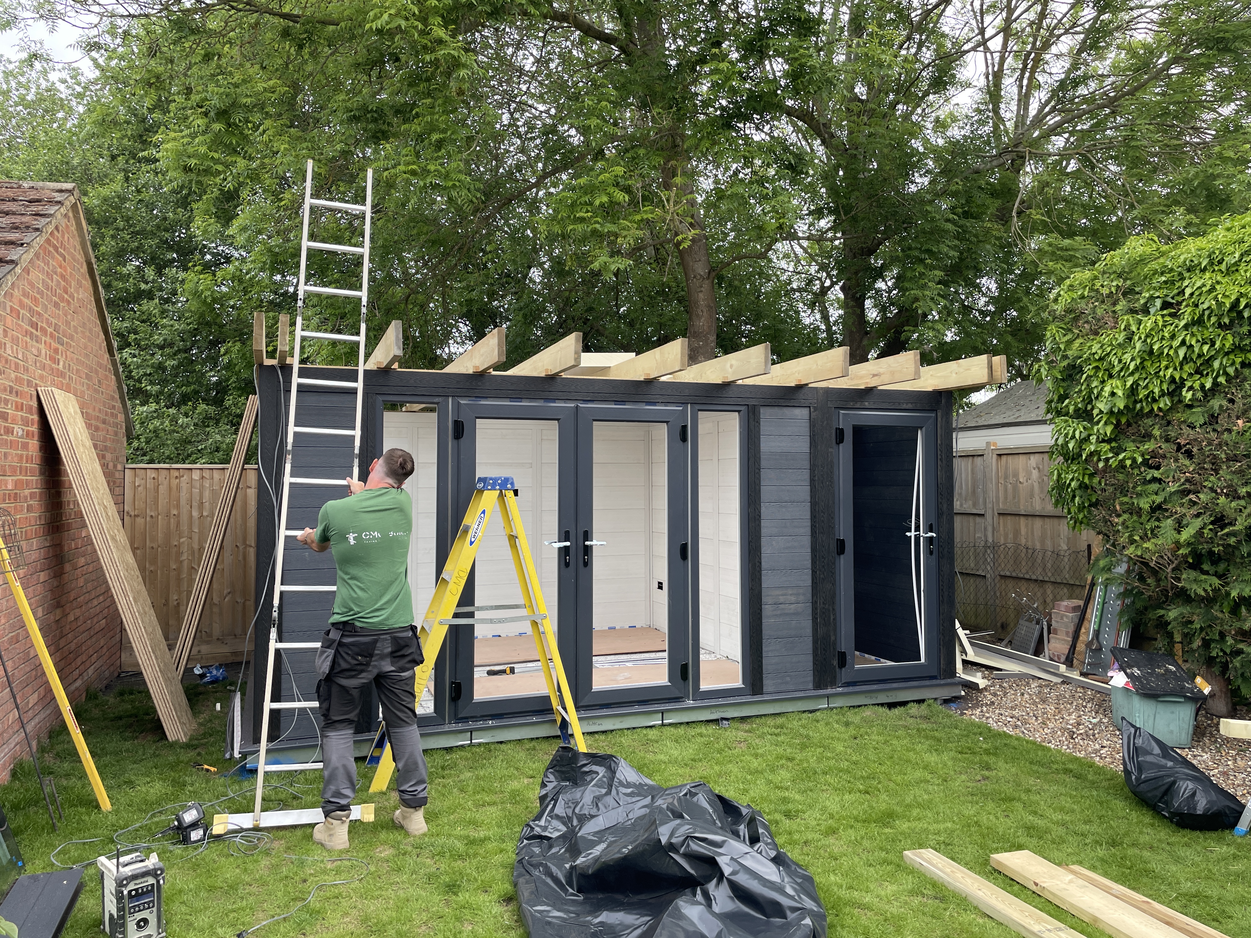 Roof structure with exposed timber joists ready for insulation and Firestone rubber membrane