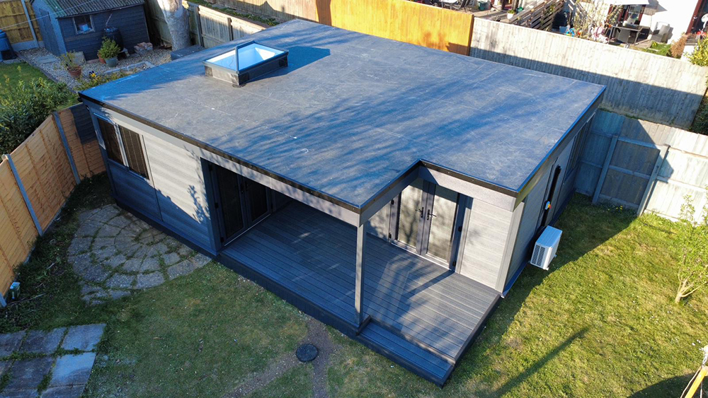 Garden annexe exterior with covered deck and skylight