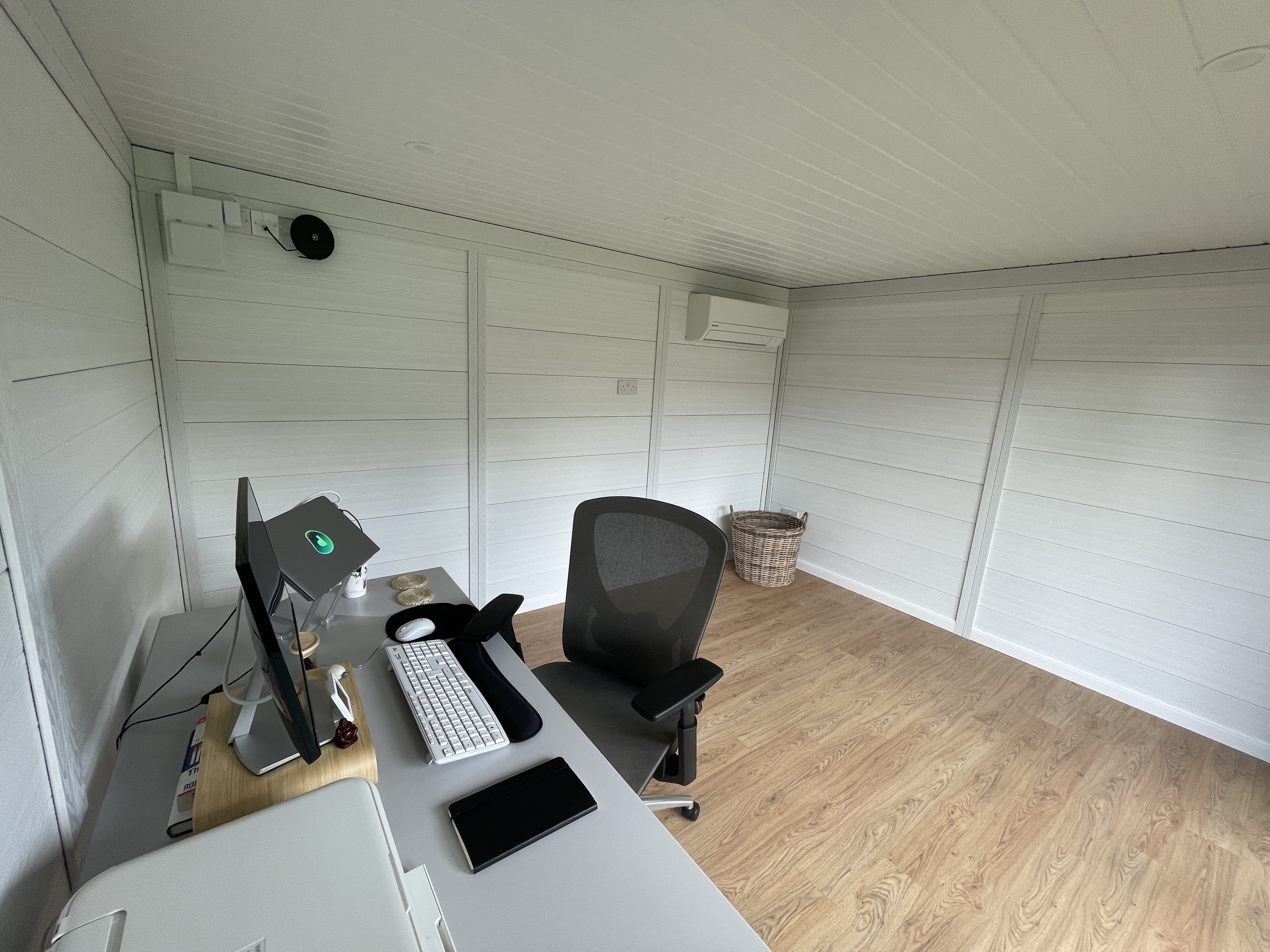 Finished garden room interior set up as a home office