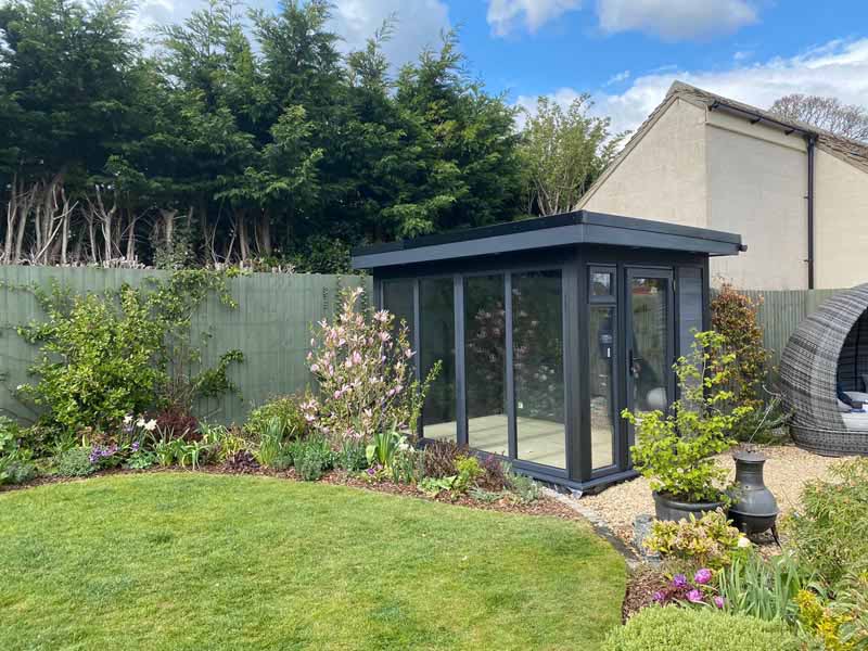 Glass garden room interior — views out to garden