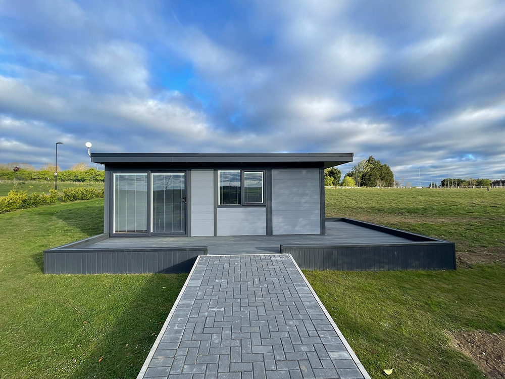 Garden annexe exterior with wrap-around deck and path