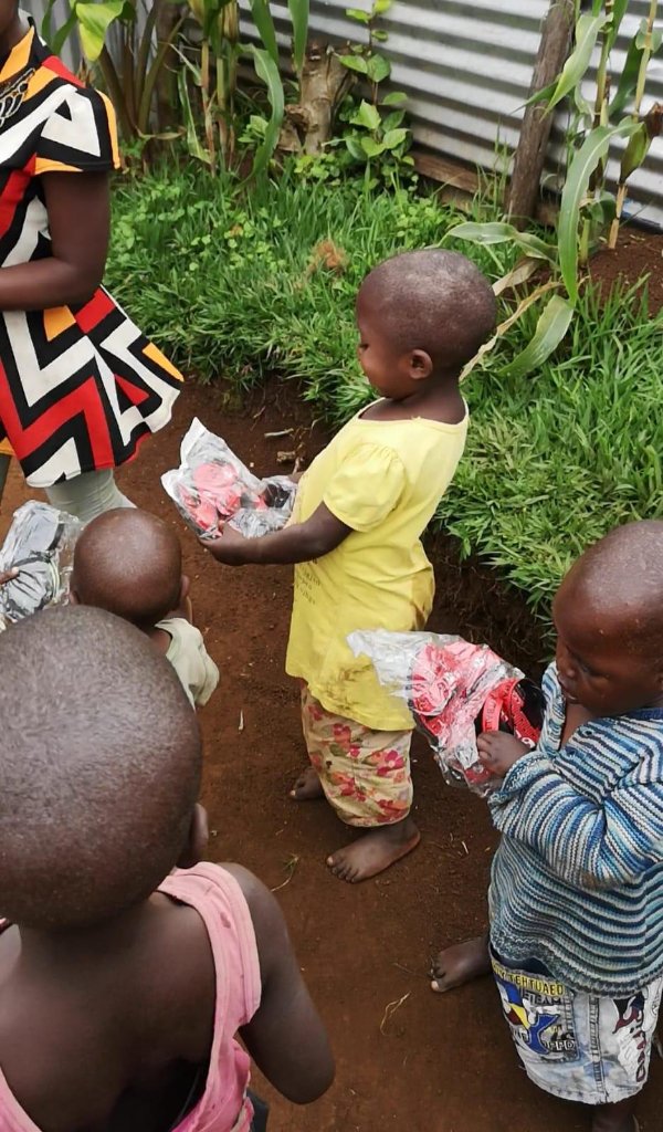 Children receiving clothing donations