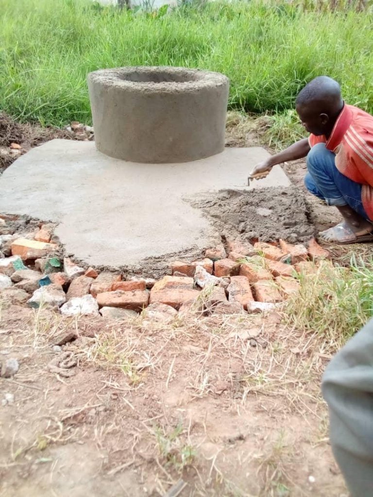Child drinking from contaminated water source
