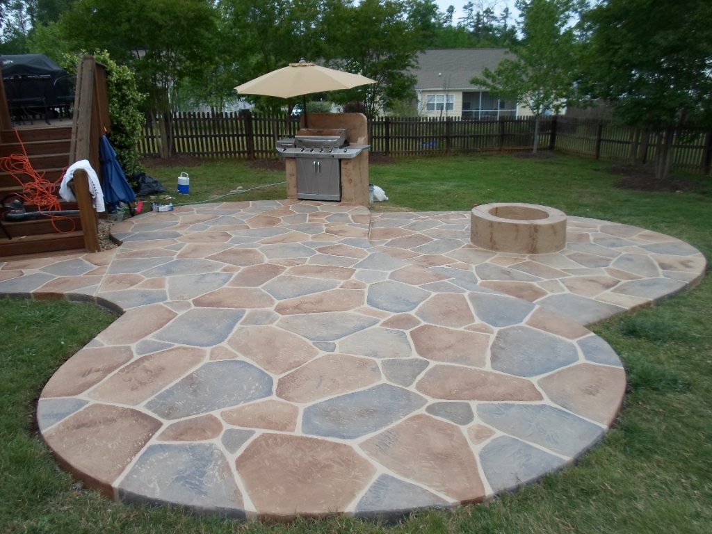 Stamped concrete patio with outdoor kitchen