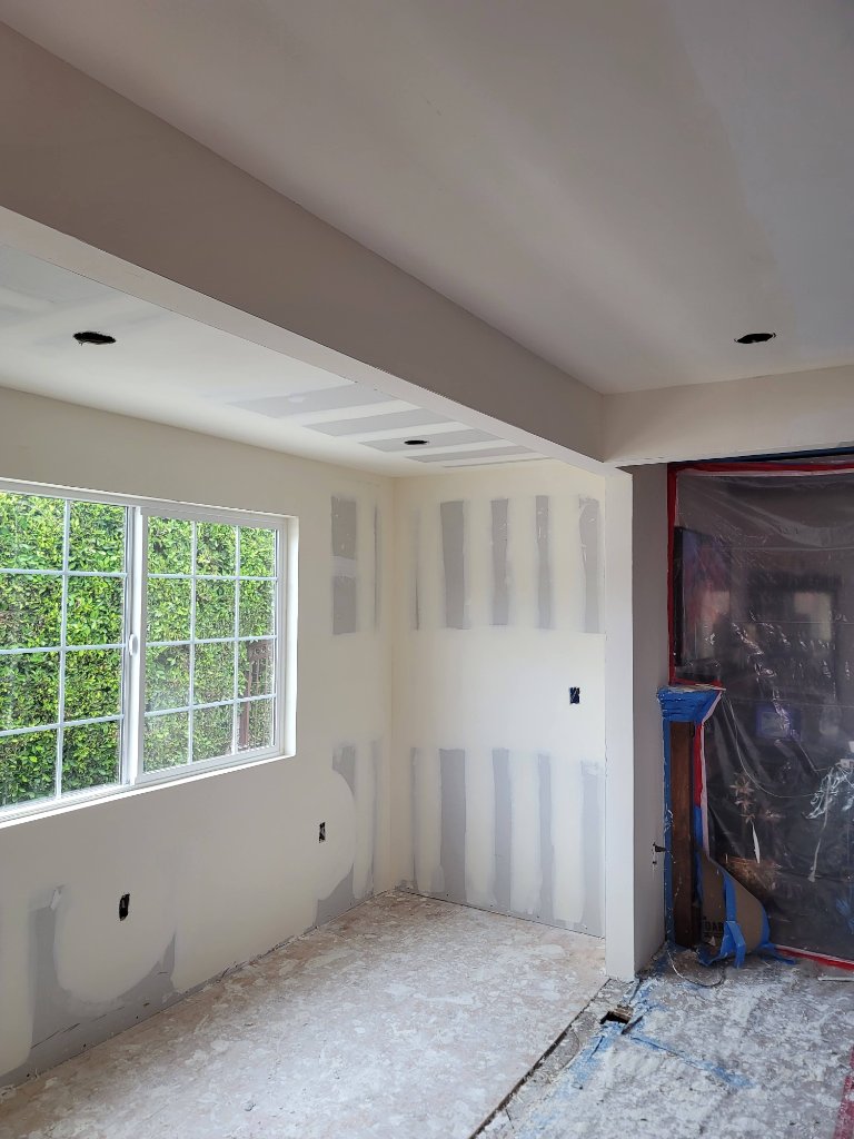 Drywall and spackle in progress — interior construction room addition Los Angeles