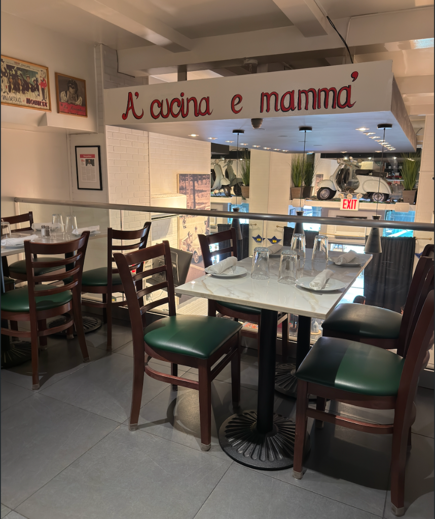 Donna Margherita NYC — Best Italian restaurant interior with A' cucina e mamma' mural, mezzanine dining area, Upper East Side New York