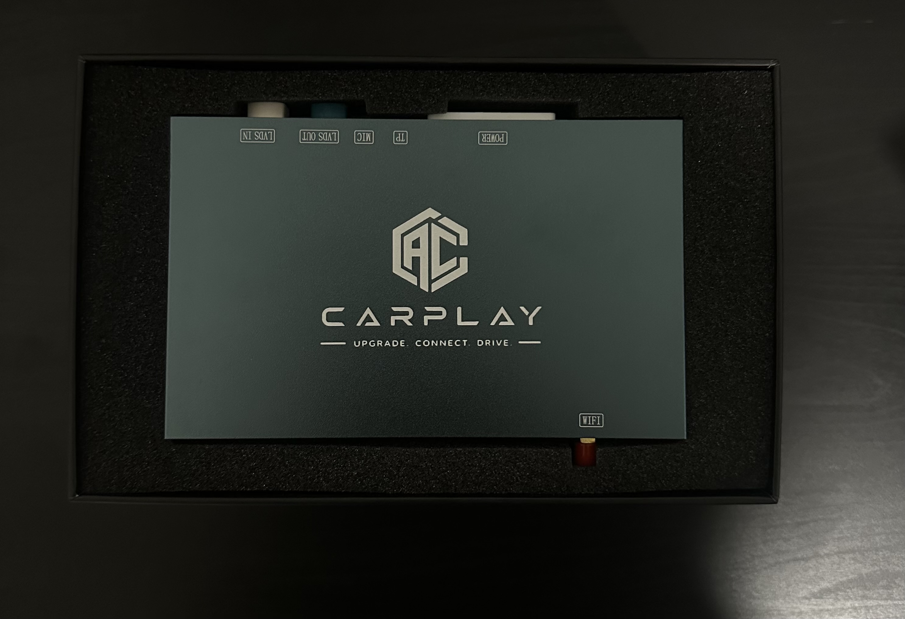 Audi CarPlay retrofit module in custom foam-lined retail packaging