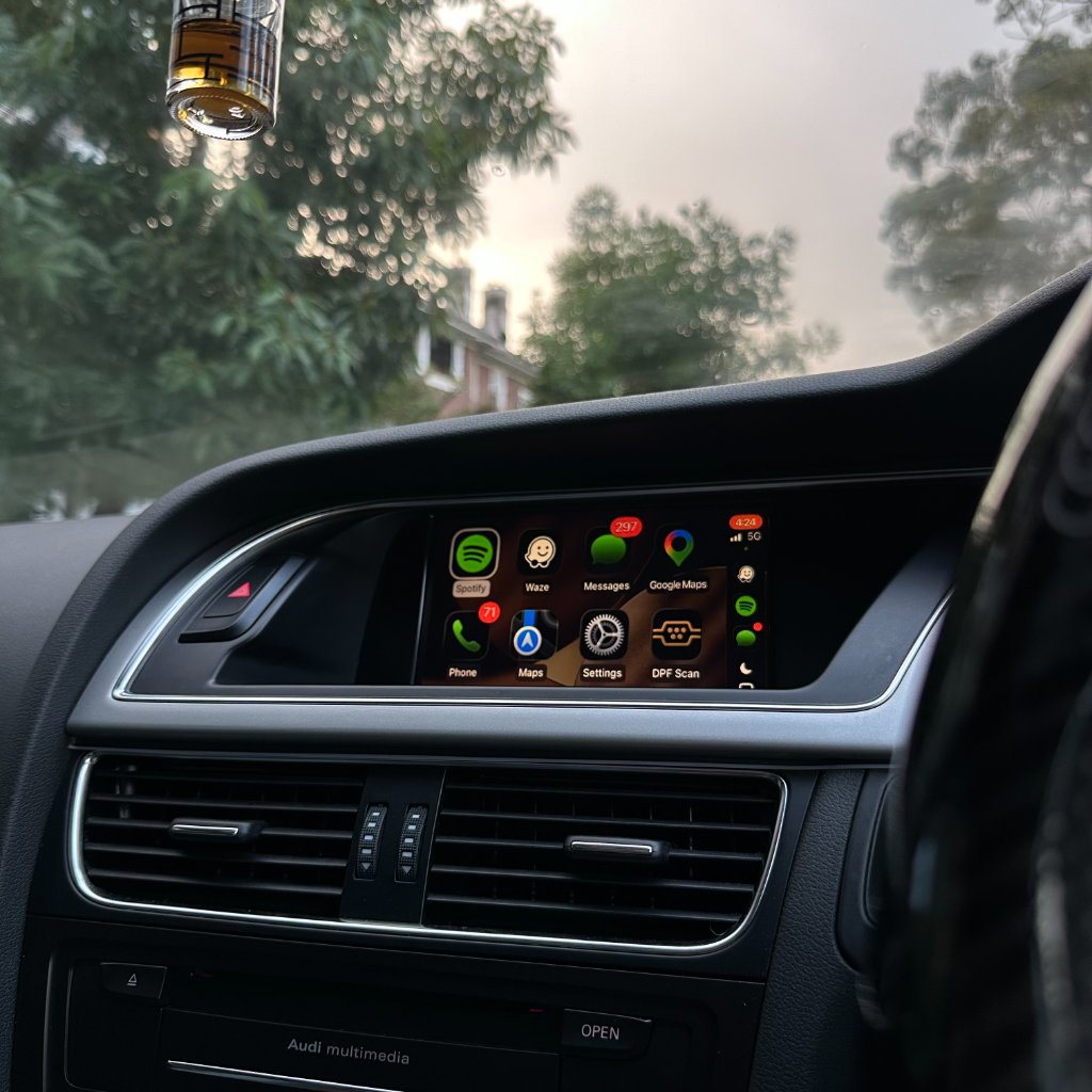Audi Apple CarPlay interface displayed on the original factory screen