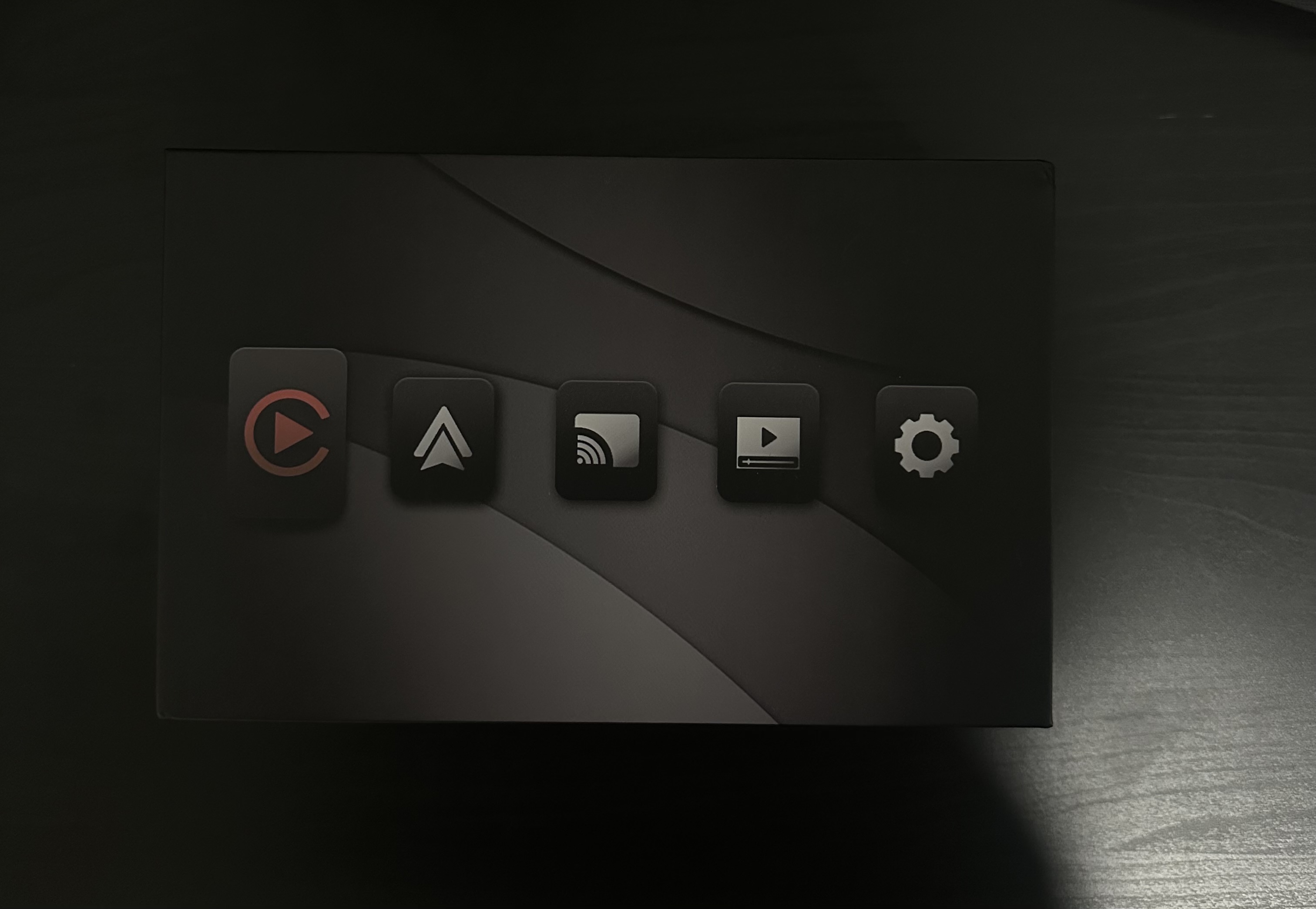 Audi CarPlay interface menu screen with navigation, media, and settings icons