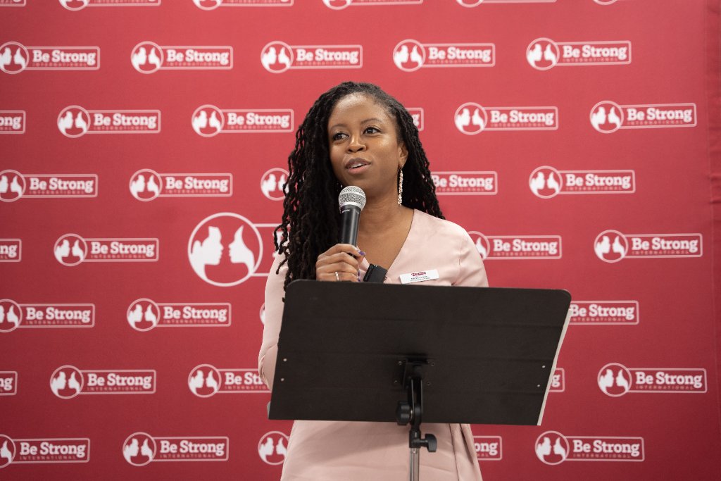 Michelle Shirley speaking at a podium