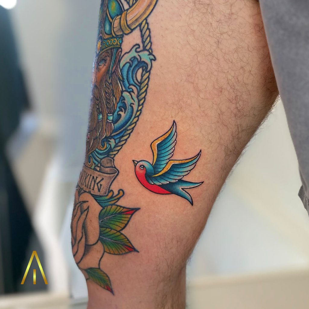 Traditional colourful swallow tattoo thigh Chiang Mai