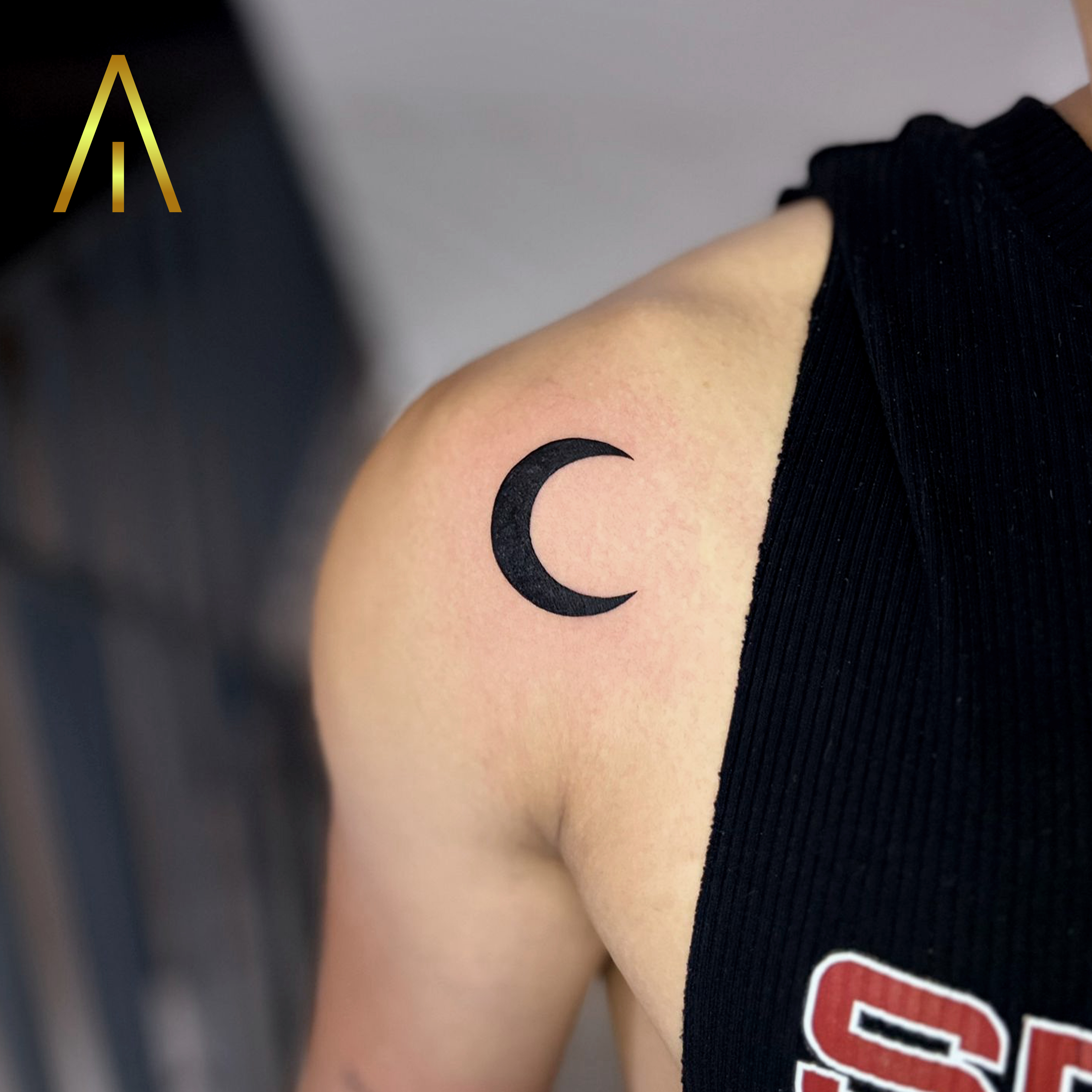 Minimal crescent moon shoulder tattoo Chiang Mai