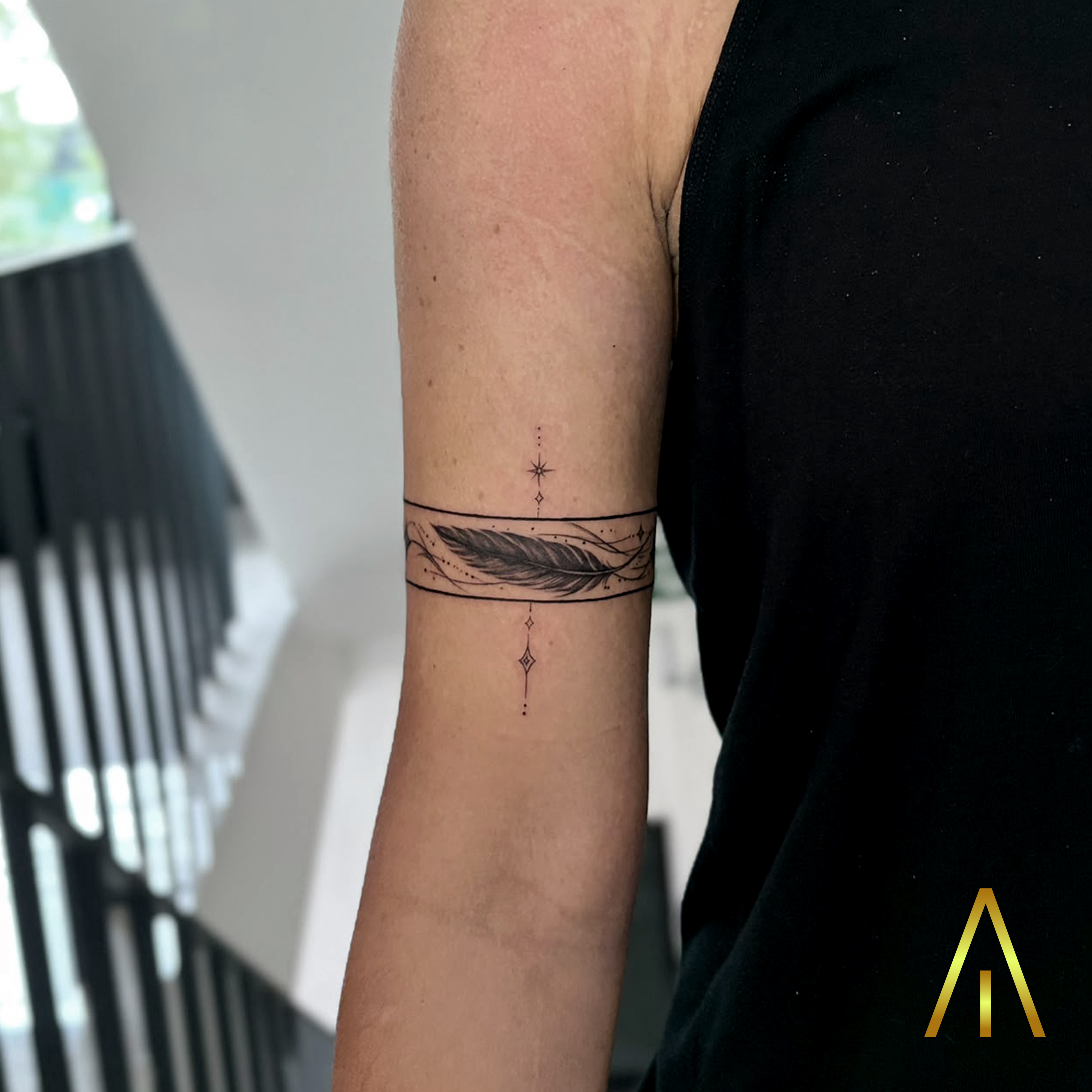 Mimi fine line feather armband upper arm tattoo Chiang Mai