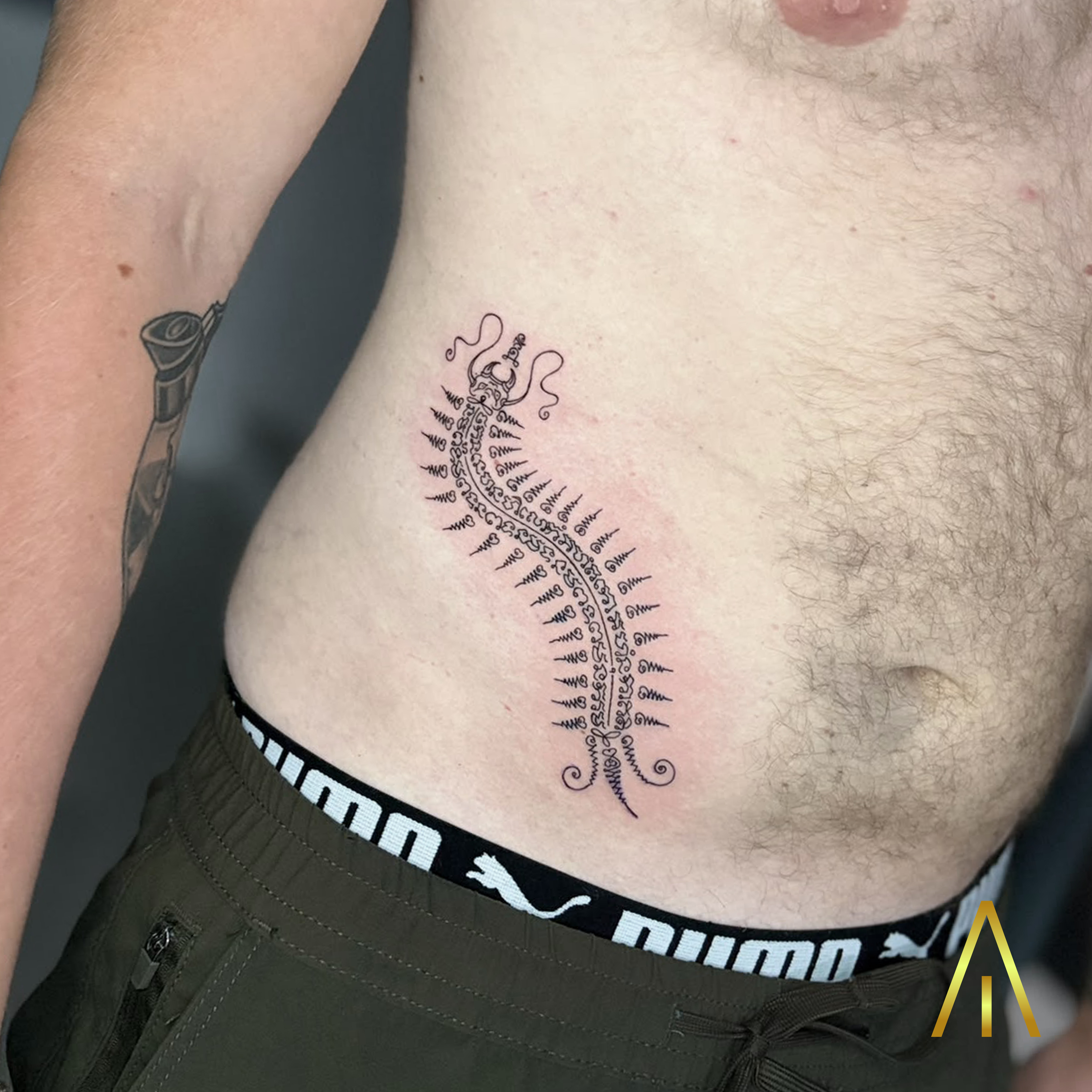 Taely Sak Yant centipede side tattoo Chiang Mai