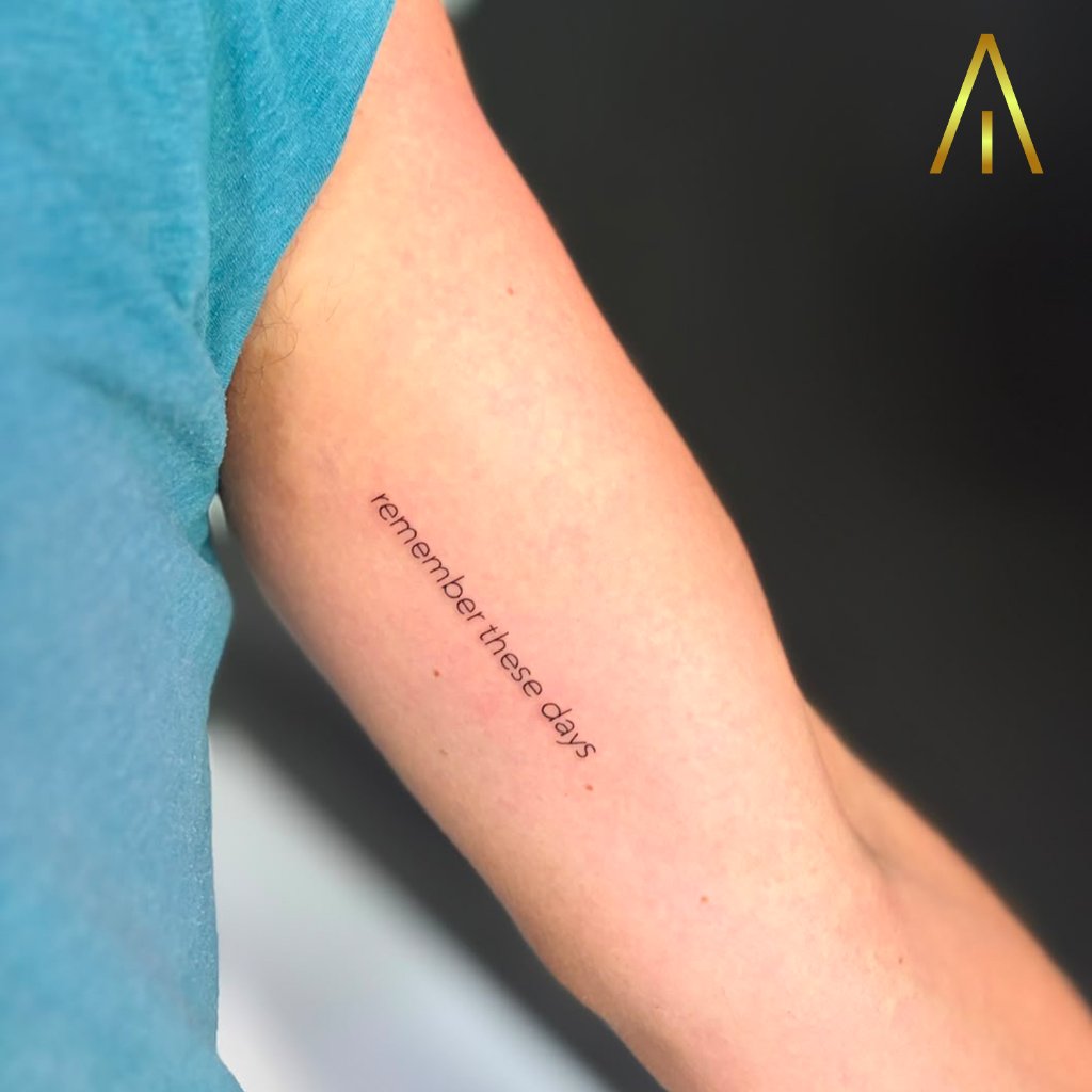 Fine line remember these days text tattoo on arm Chiang Mai