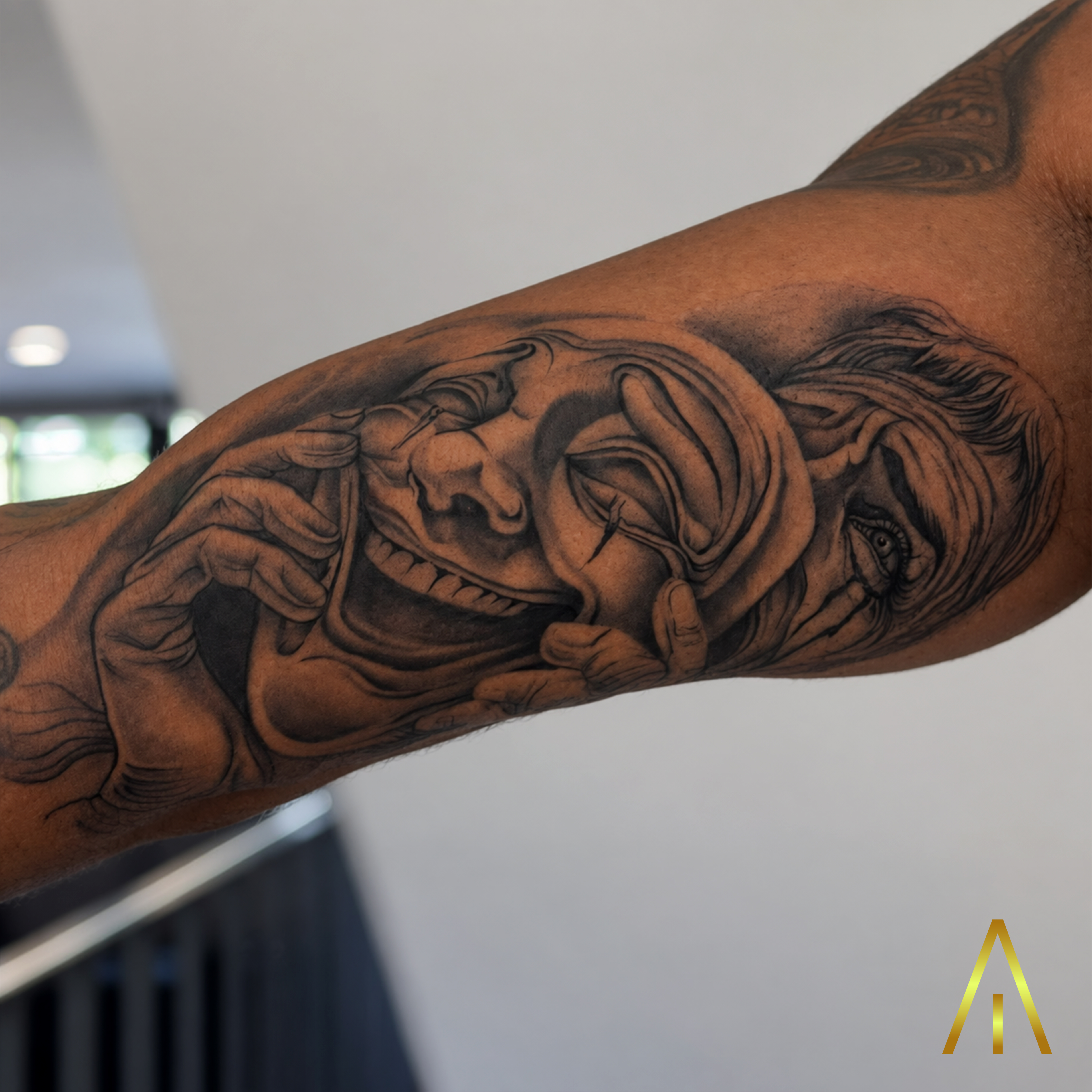 Jean laughing now crying later drama masks black and grey forearm tattoo Chiang Mai