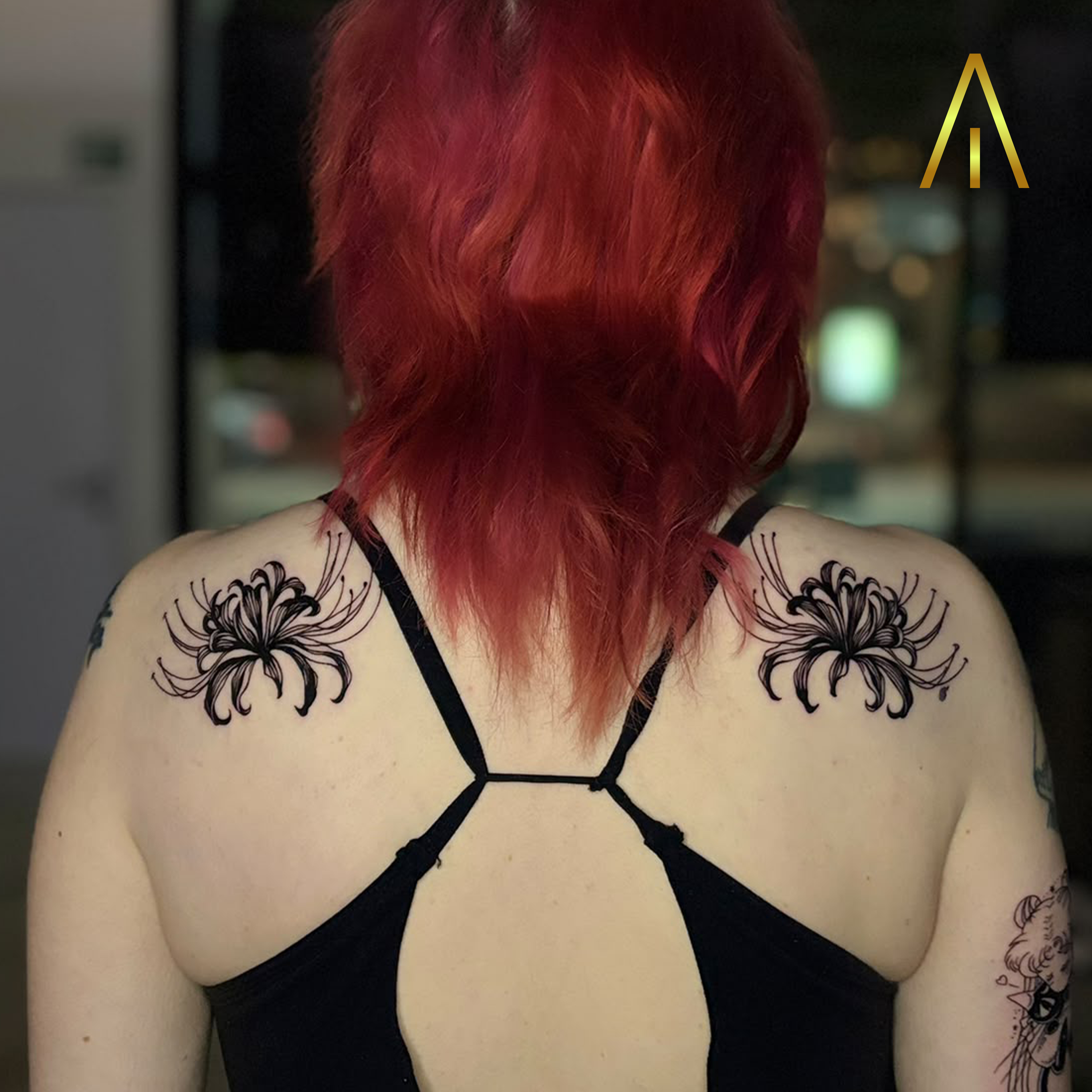 Blackwork spider lily upper back tattoo Chiang Mai