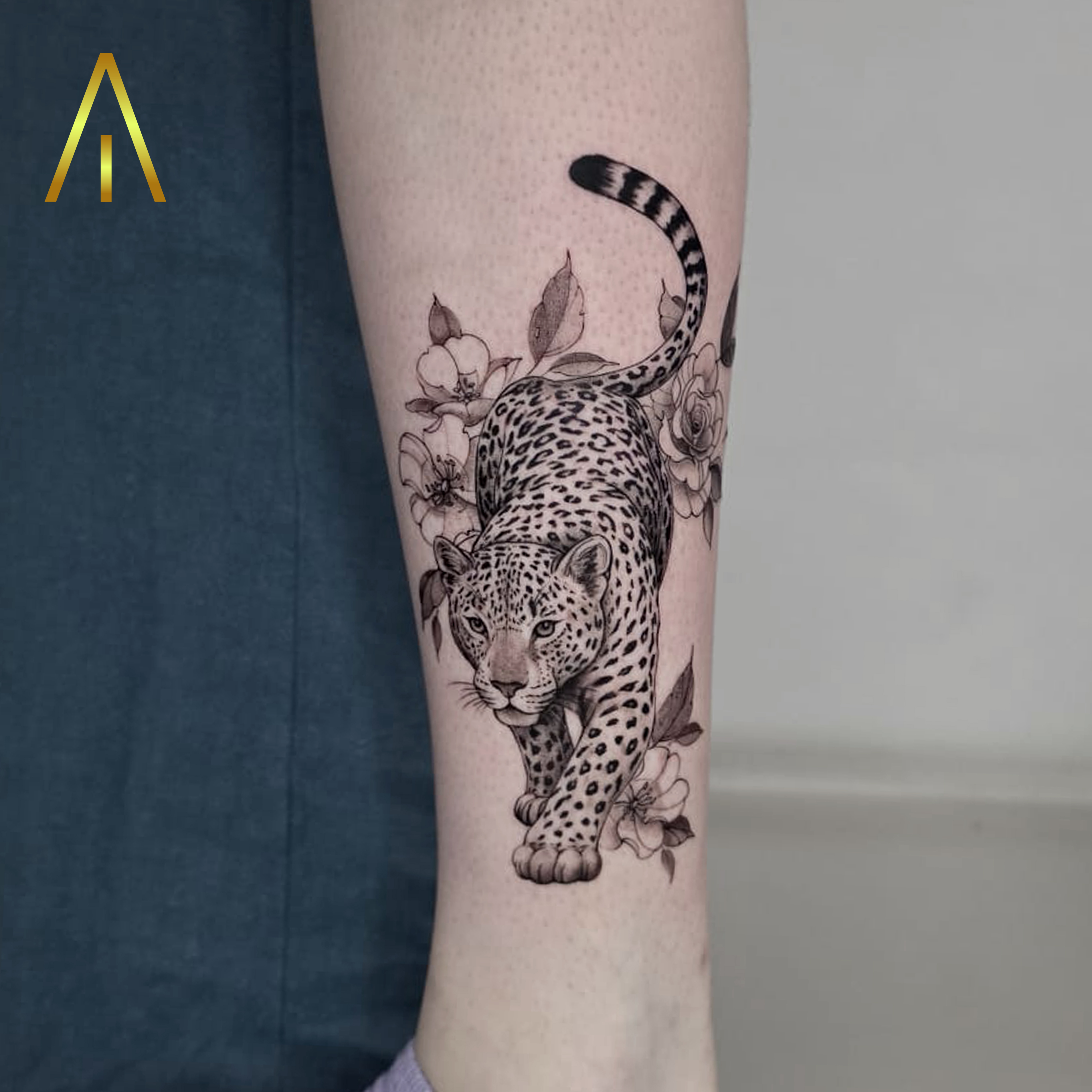 Katie micro realistic leopard and flowers forearm tattoo Chiang Mai