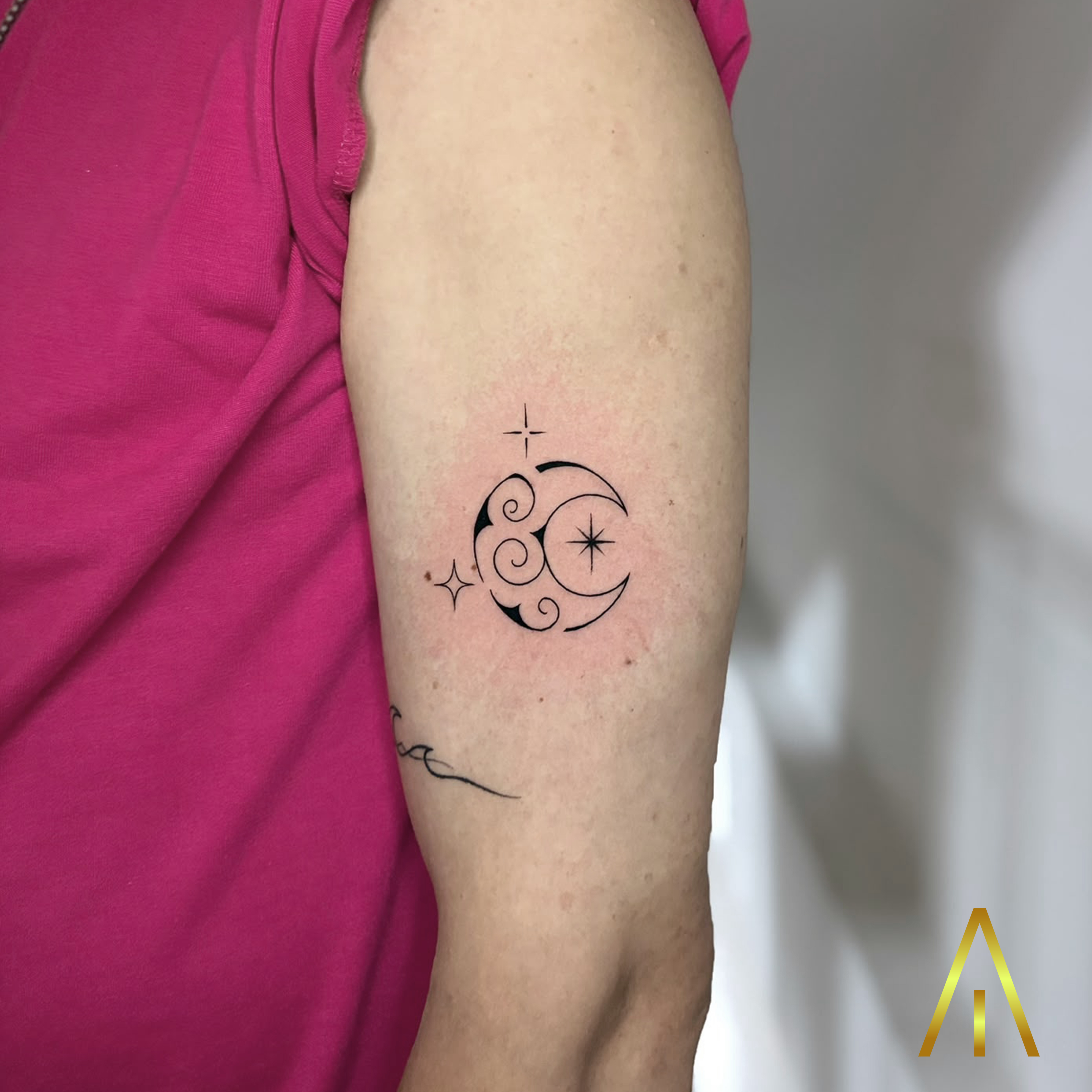 Mimi crescent moon with clouds and stars fine line upper arm tattoo Chiang Mai