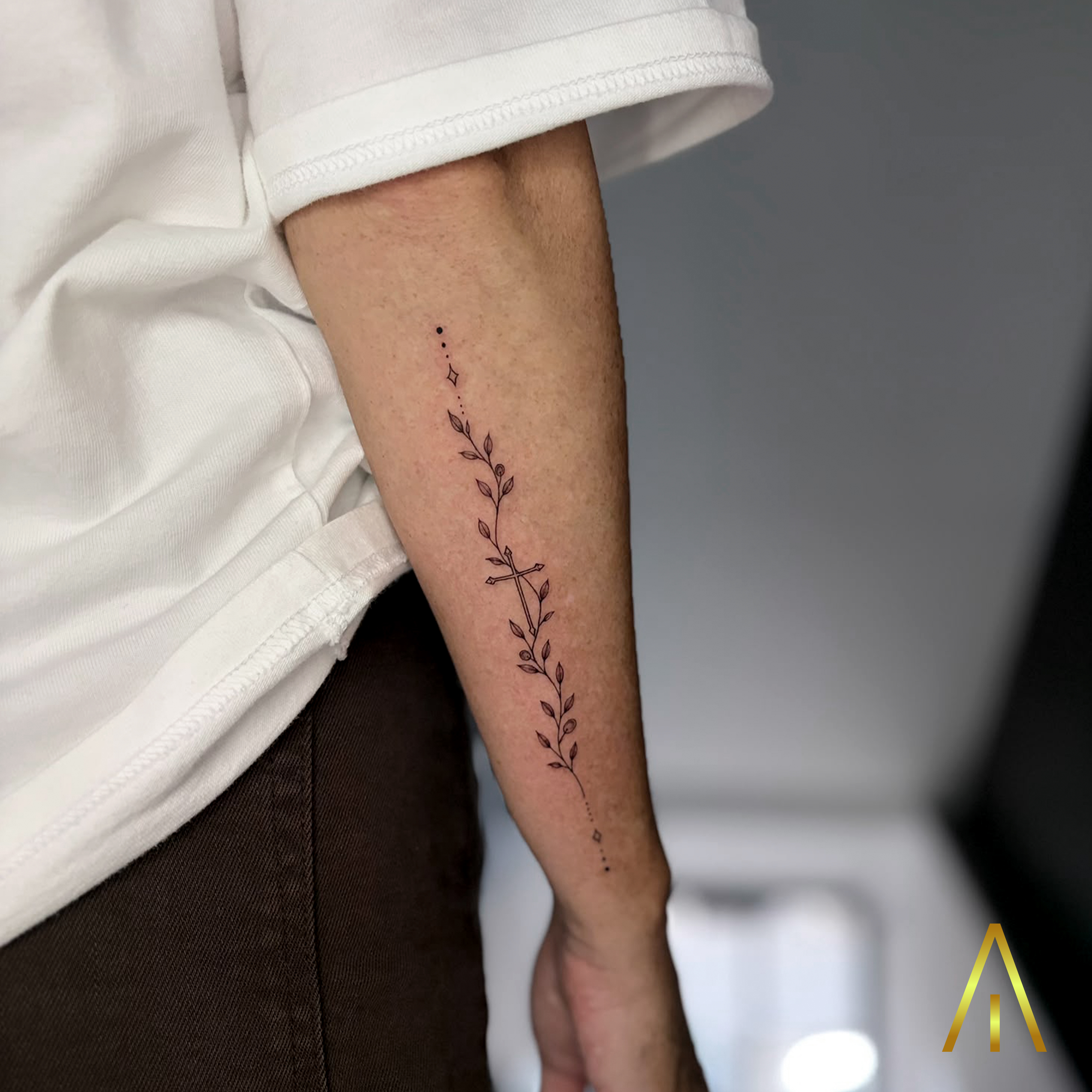 Fine line vine with cross forearm tattoo Chiang Mai