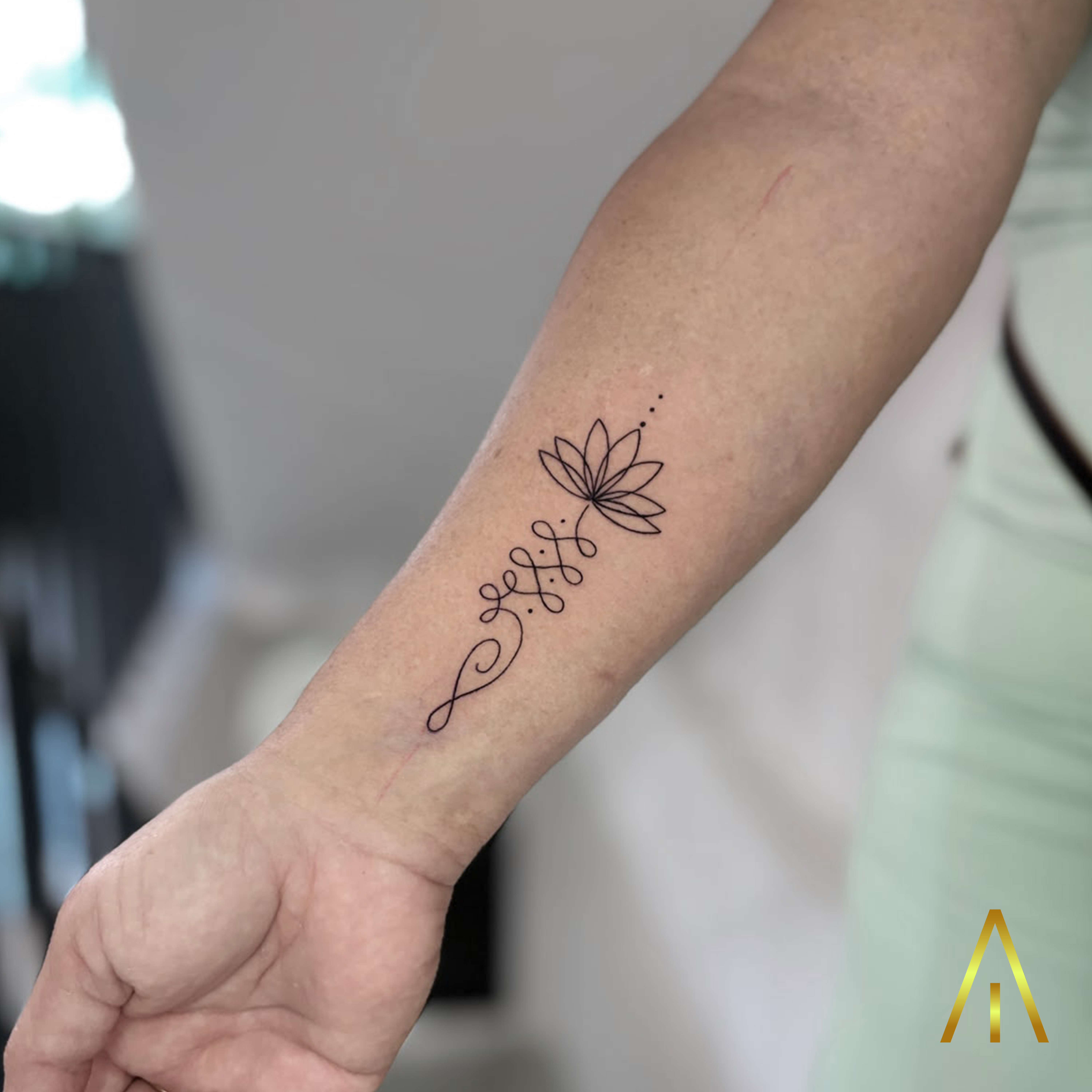 Taely unalome lotus fine line forearm tattoo Chiang Mai