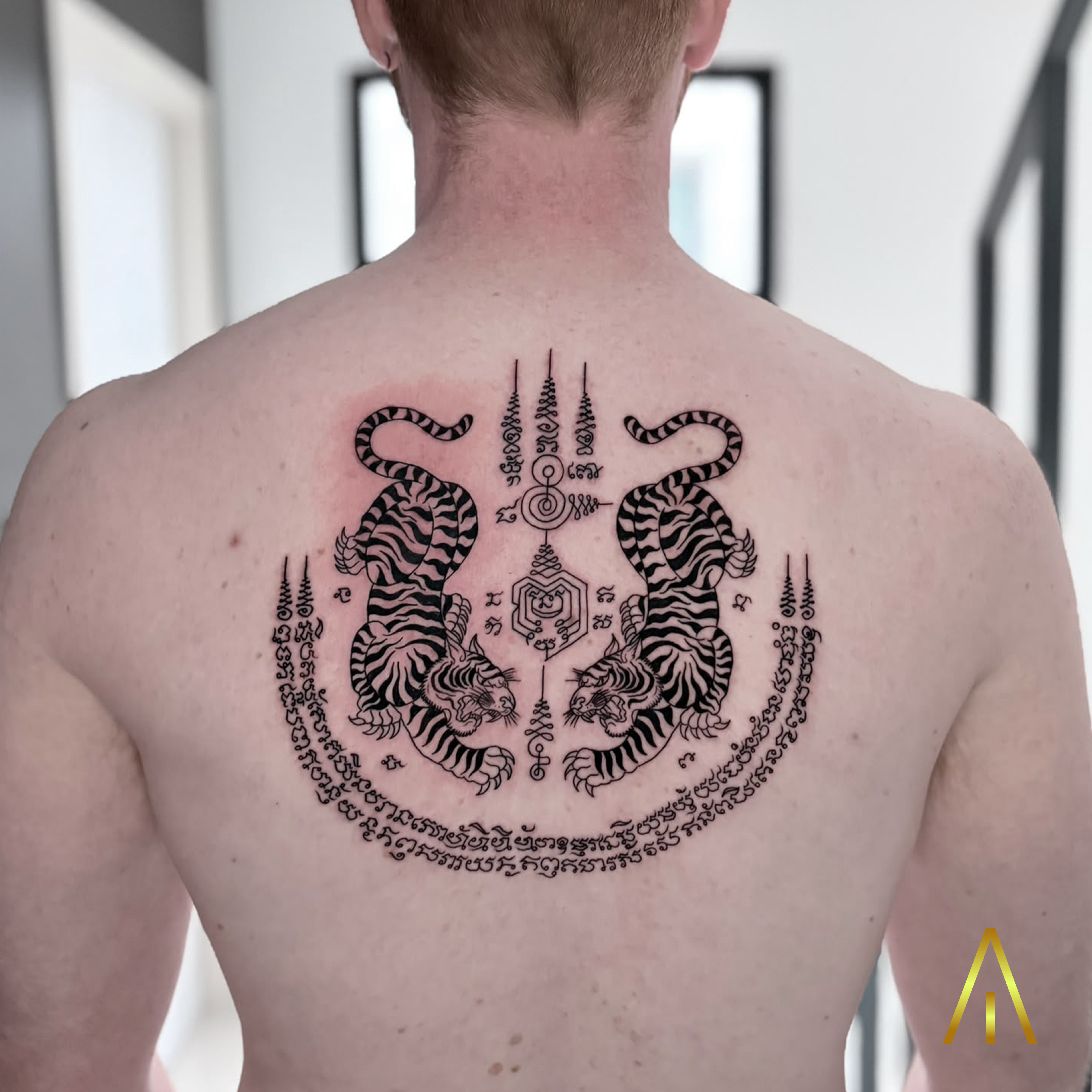 Taely Sak Yant twin tigers upper back tattoo Chiang Mai