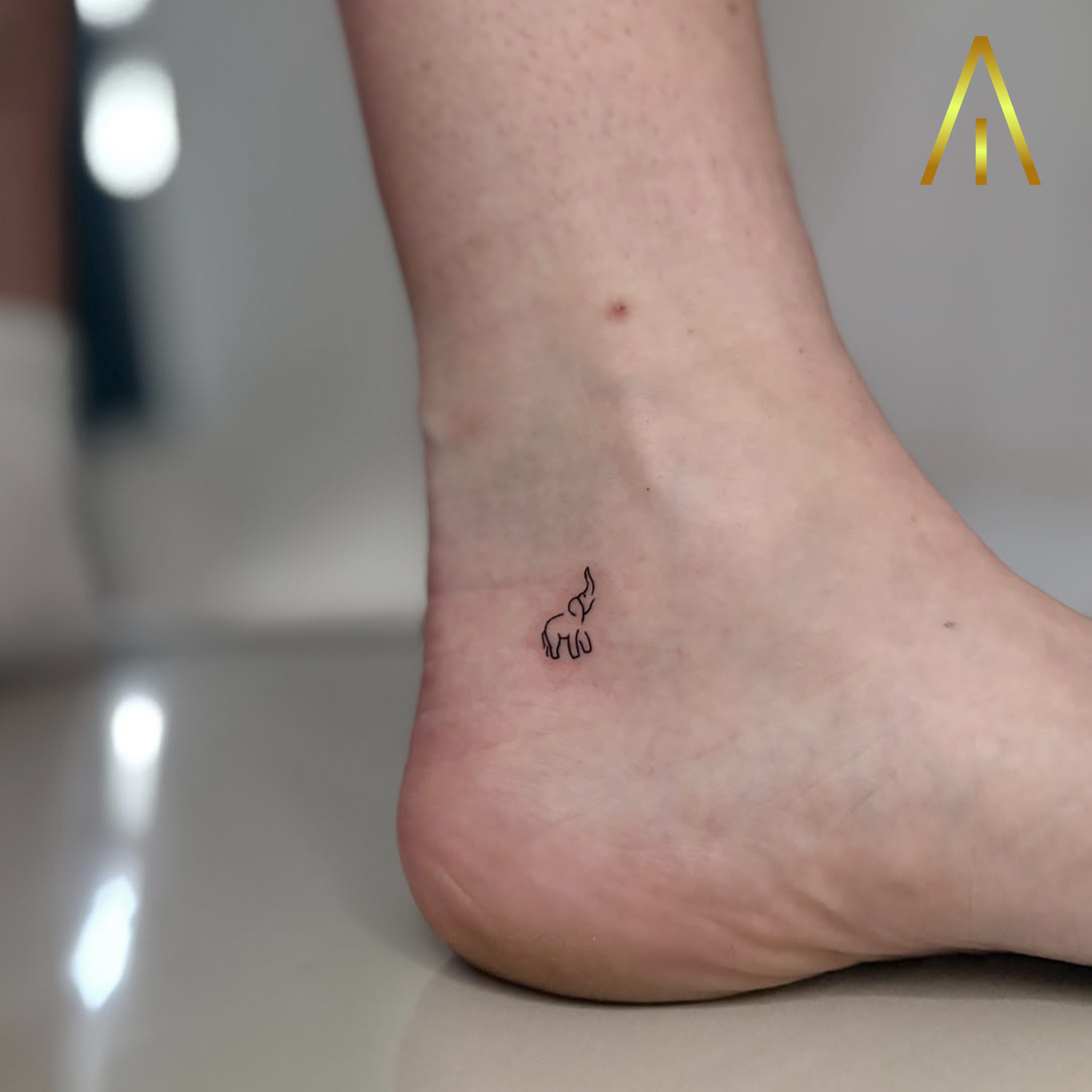 Mimi standing elephant single line fine line ankle tattoo Chiang Mai