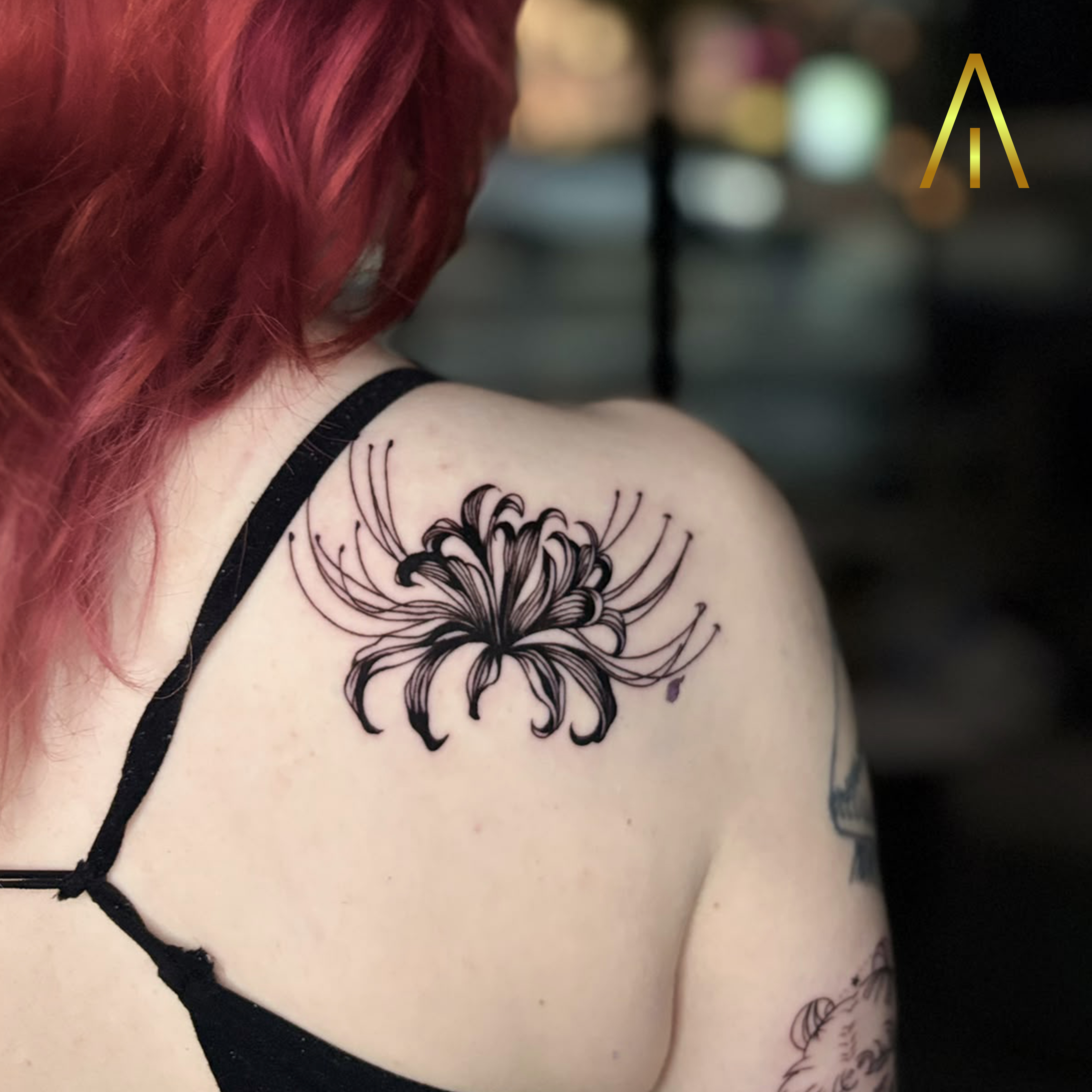 Blackwork red spider lily shoulder tattoo Chiang Mai