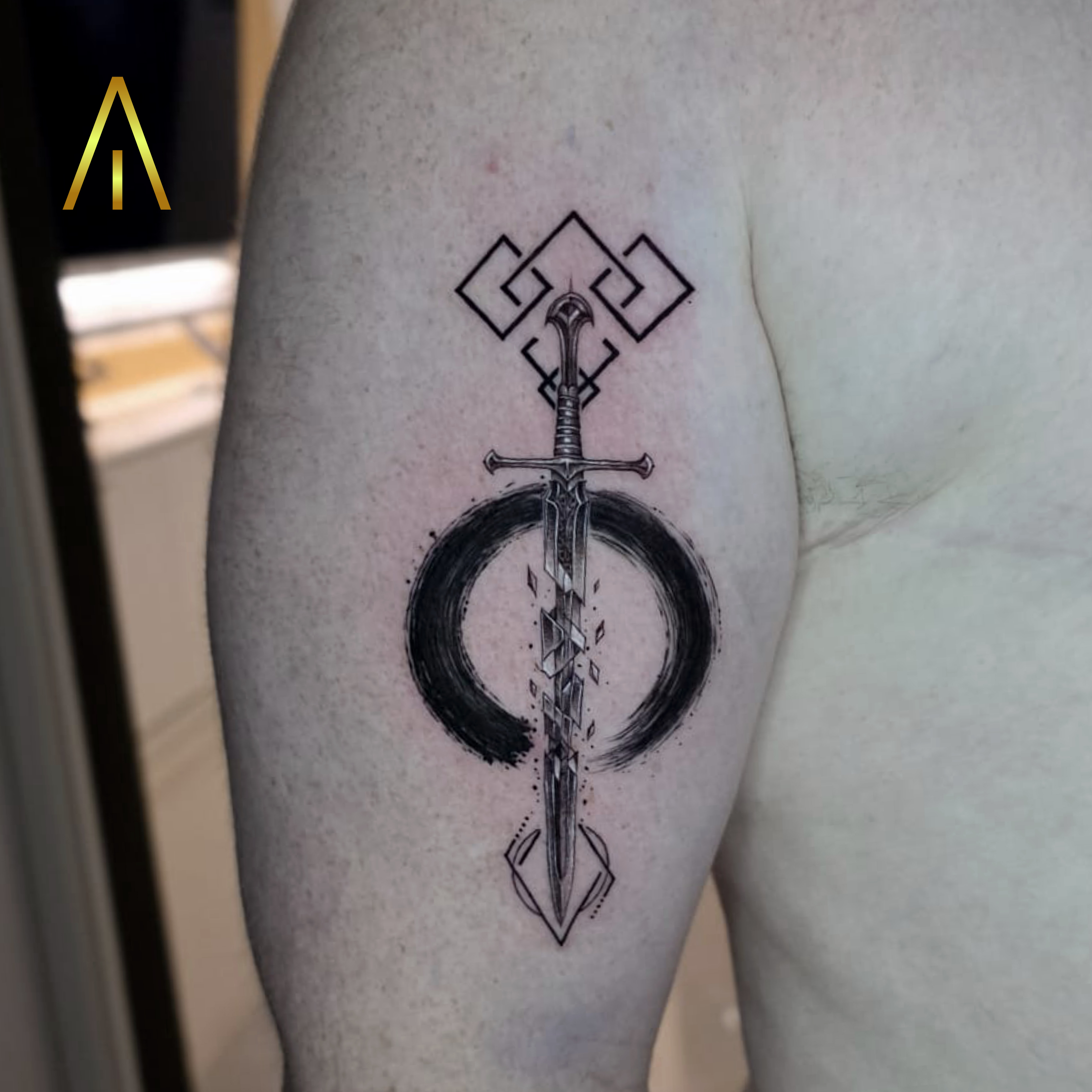Fractured sword enso minimal tattoo by Miaa Chiang Mai