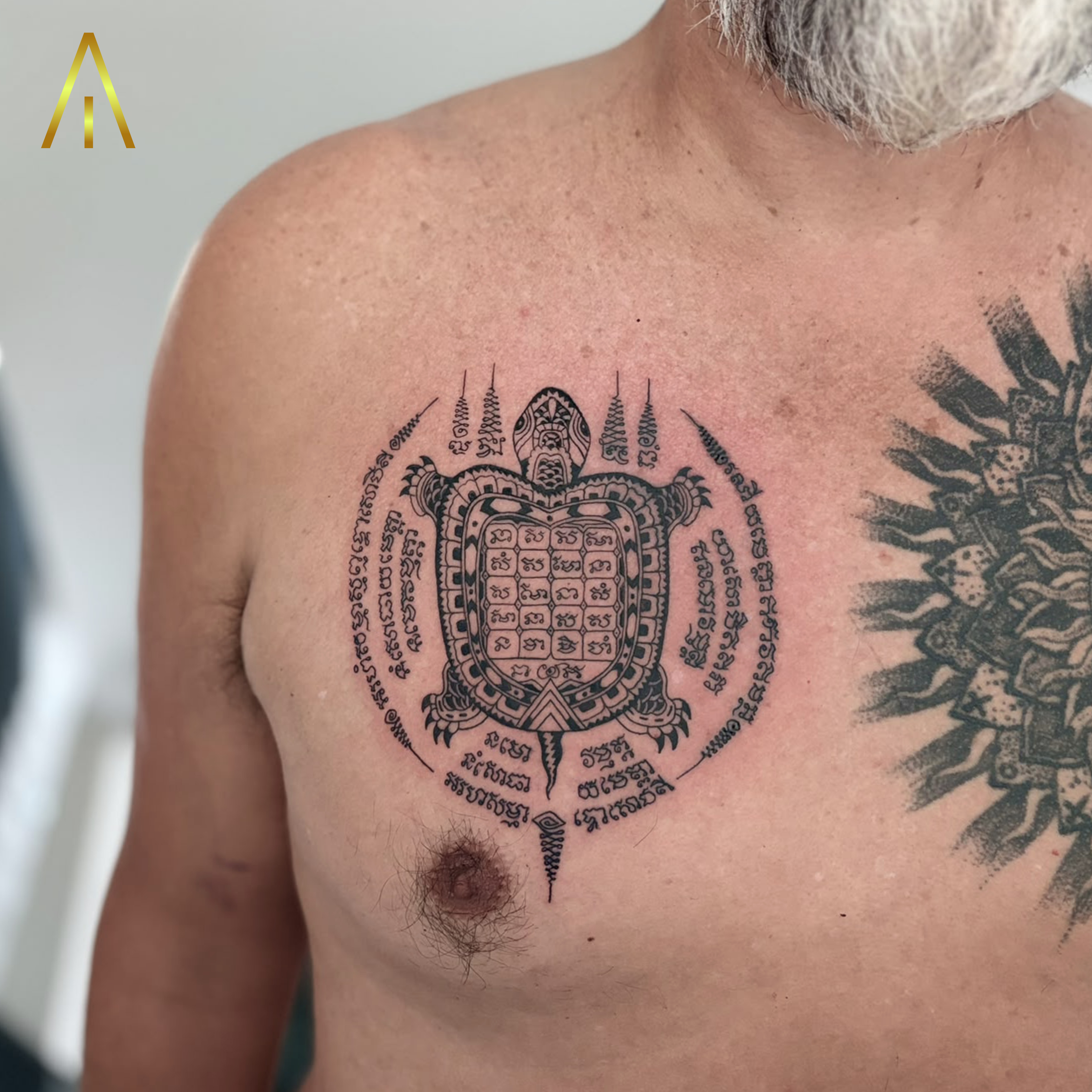 Taely Sak Yant turtle chest tattoo Chiang Mai