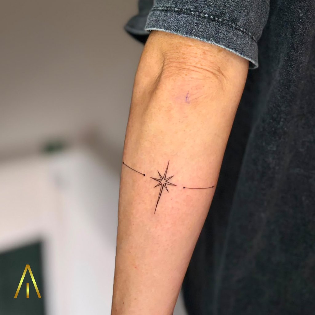 Fine line star with horizontal lines tattoo on forearm Chiang Mai