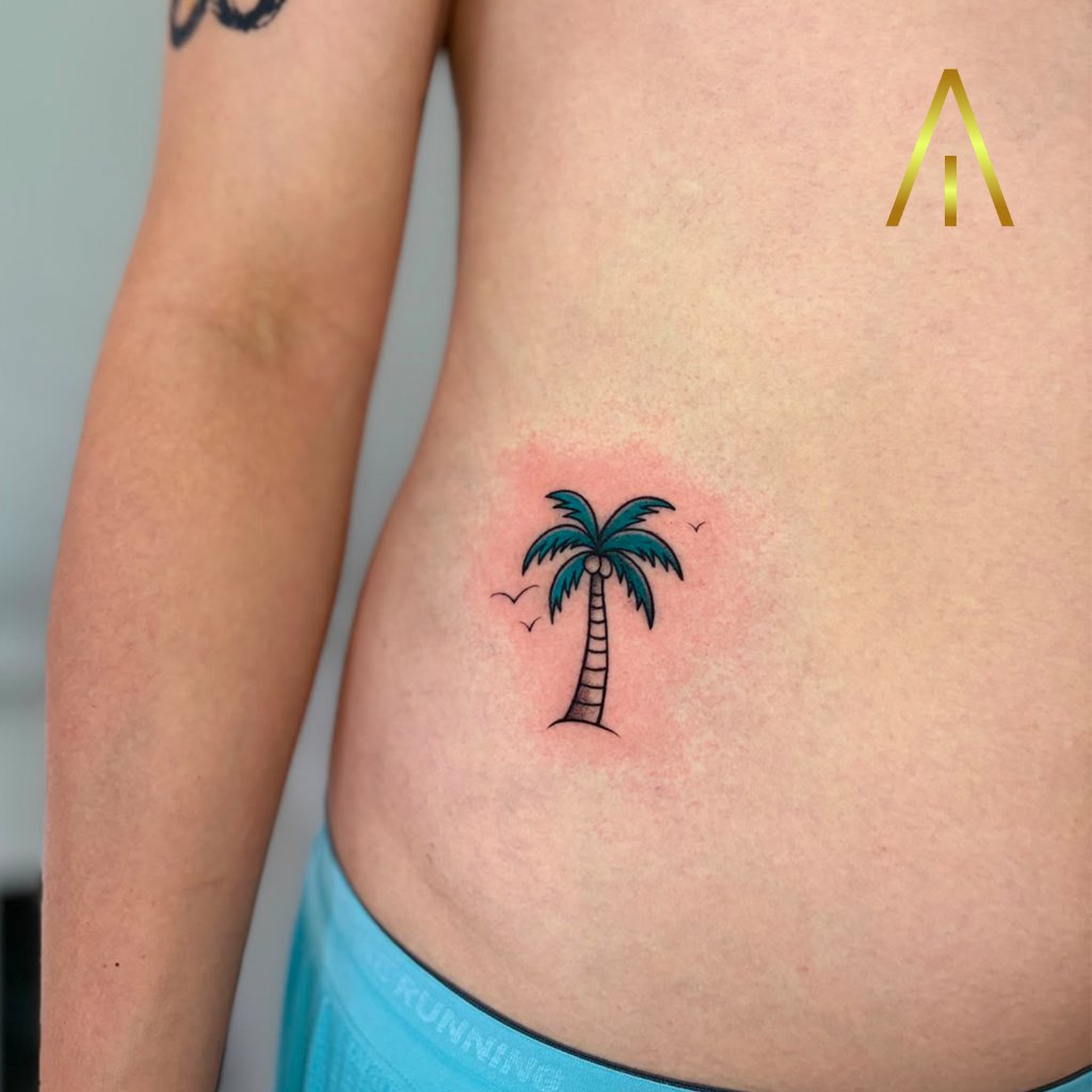 Minimal palm tree with birds fine line tattoo on side Chiang Mai