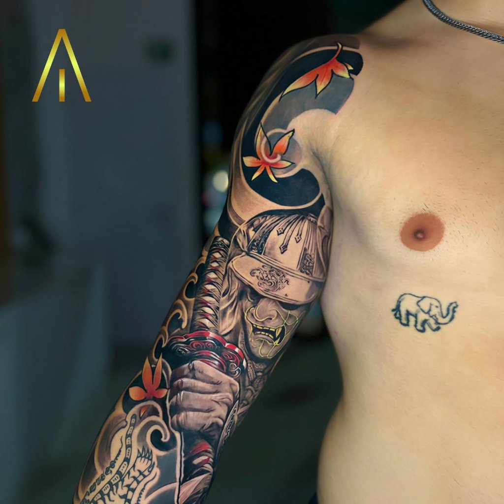 Japanese samurai with maple leaves tattoo on upper arm Chiang Mai