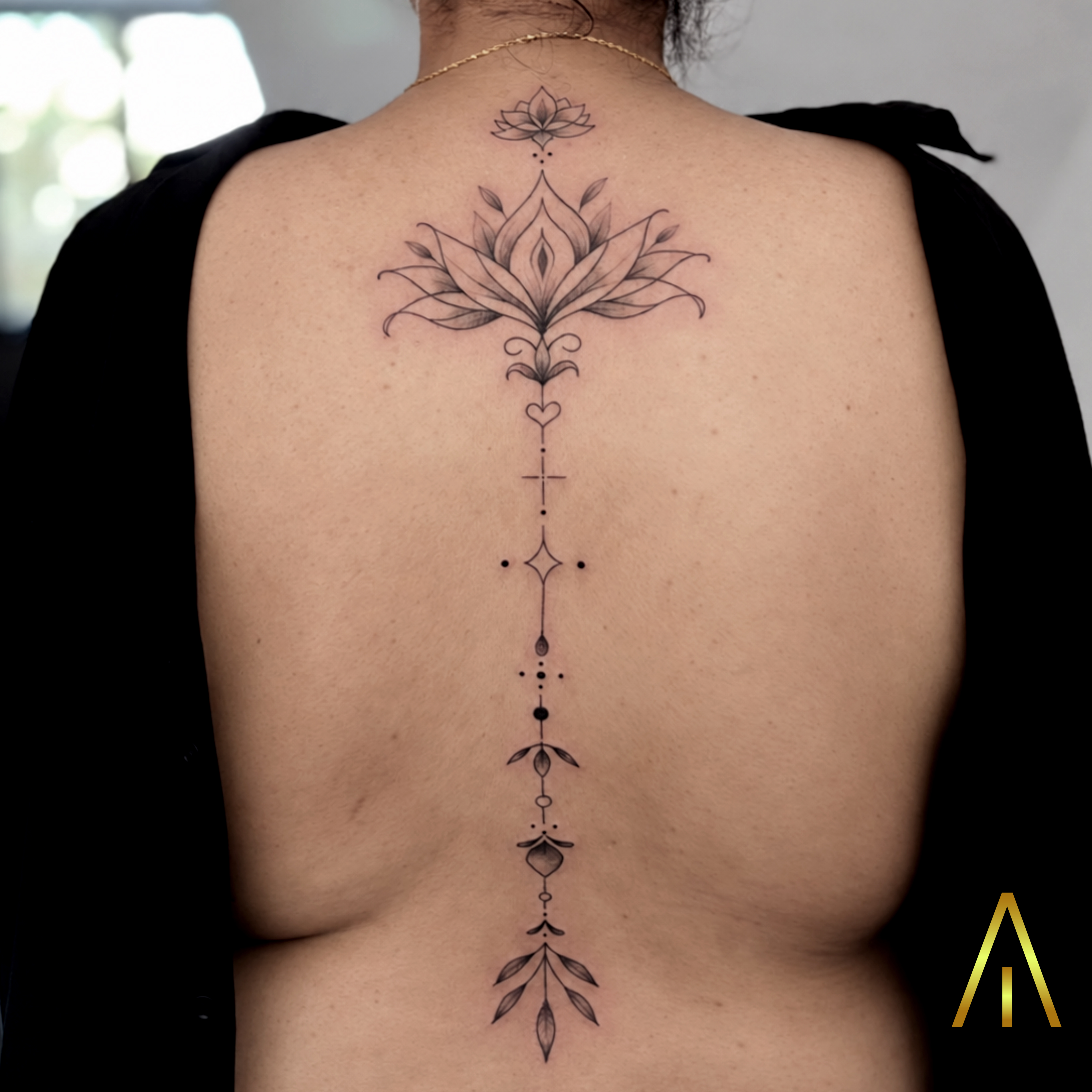 Miaa fine line ornamental spine back tattoo Chiang Mai