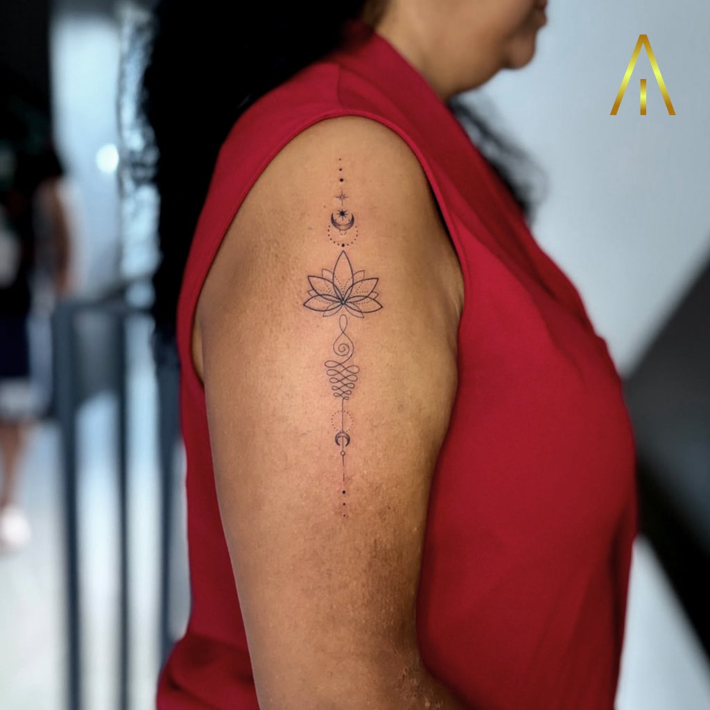 Fine line lotus unalome moon upper arm tattoo Chiang Mai