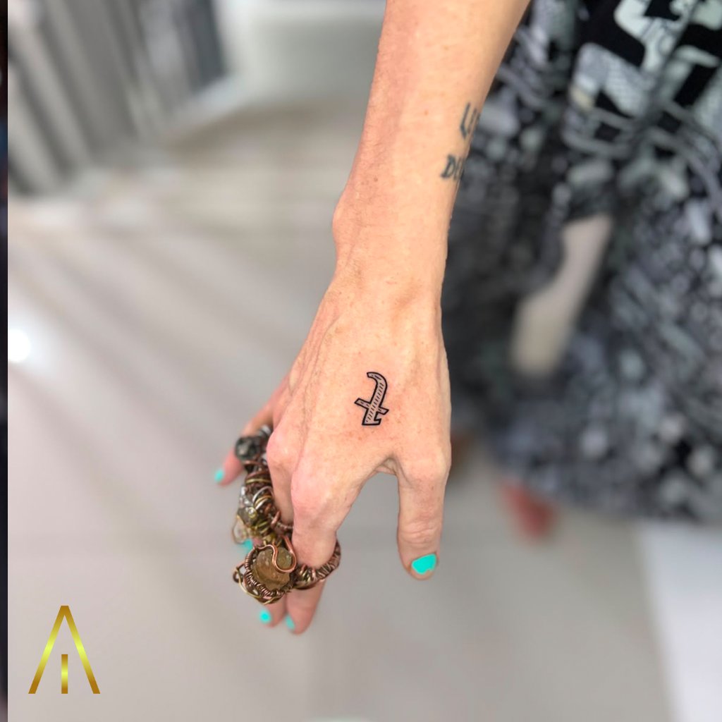 Fine line minimalist tattoo on the back of the hand, Artisan Ink Chiang Mai