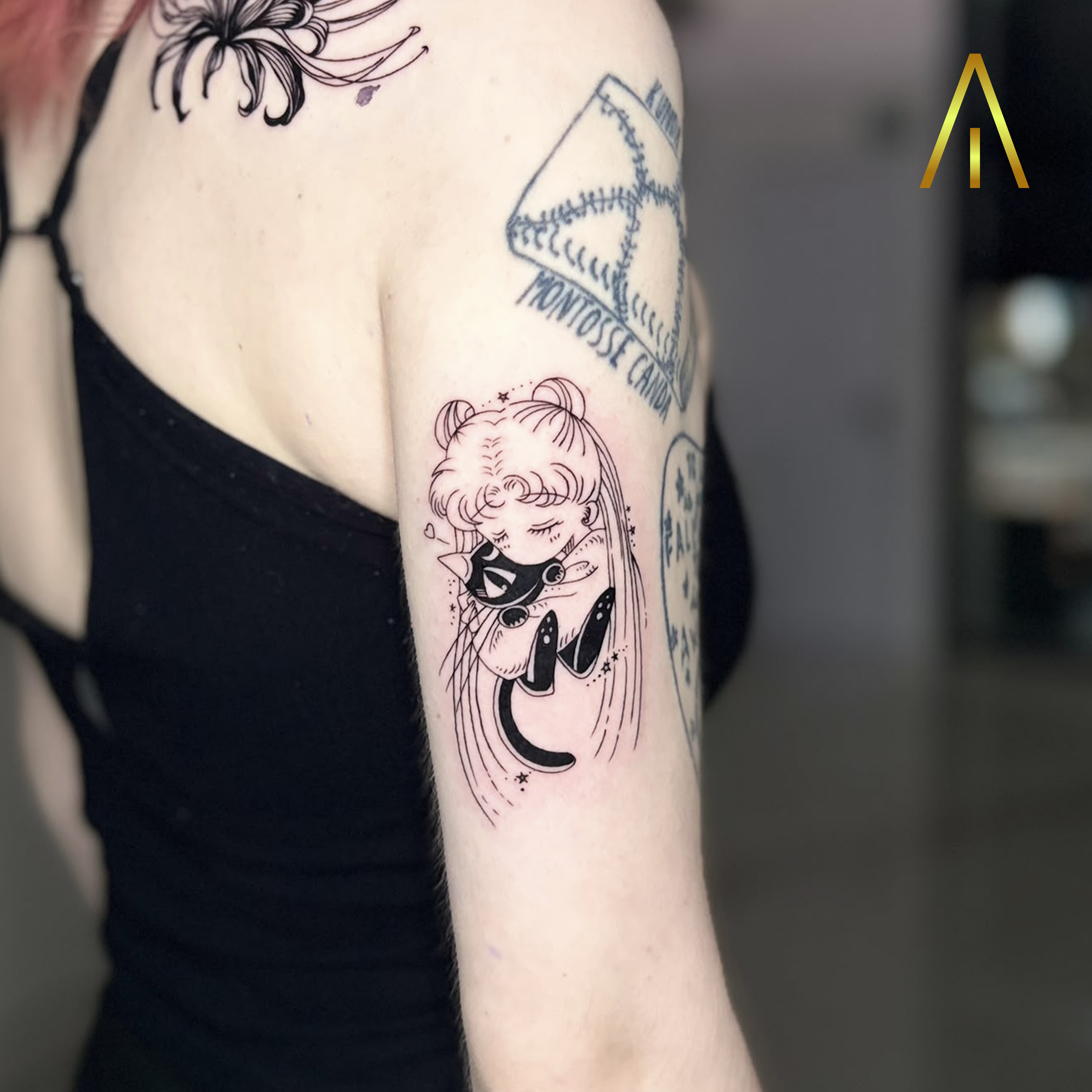 Miaa minimal Sailor Moon and Luna cat upper arm tattoo Chiang Mai