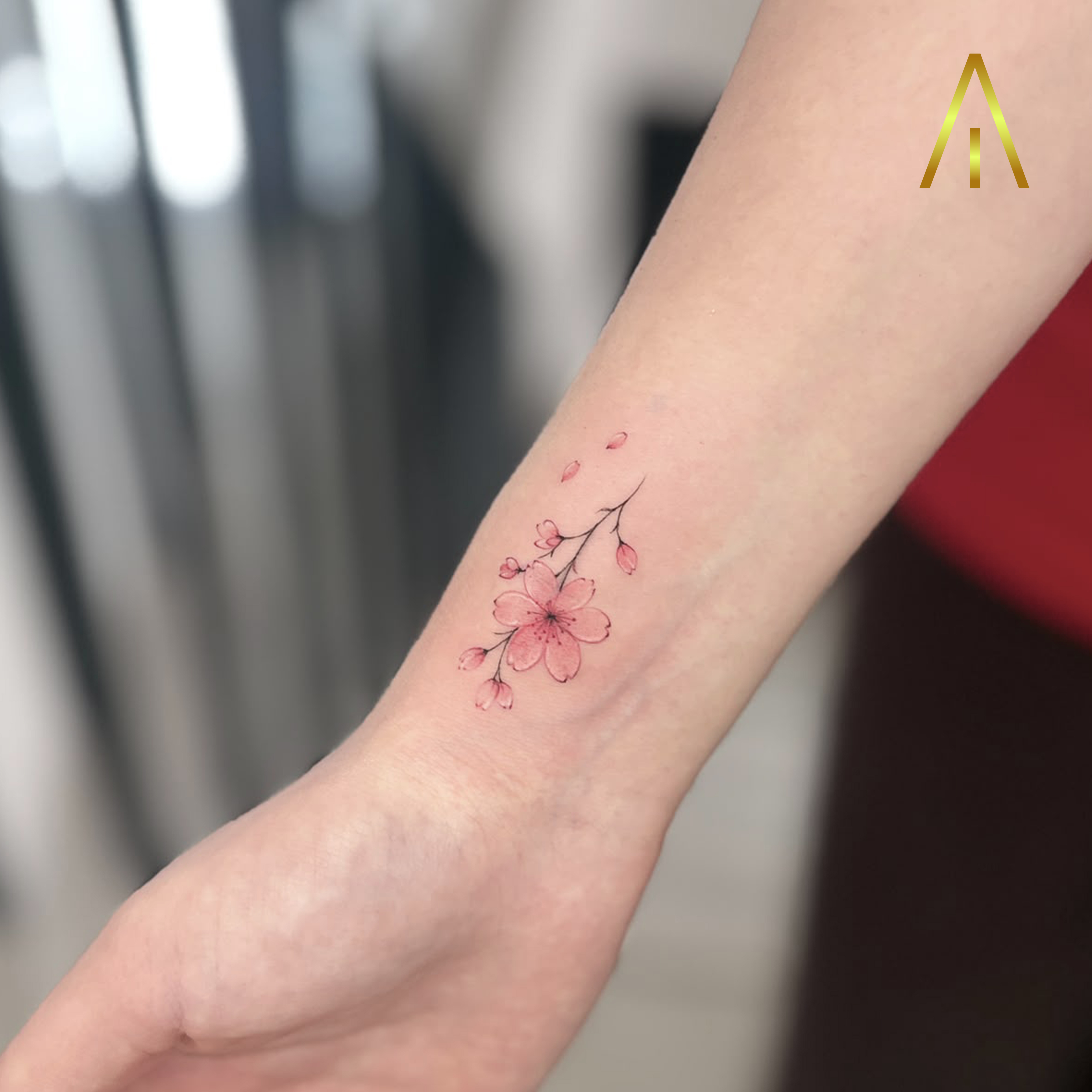 Miaa minimal cherry blossom wrist tattoo Chiang Mai