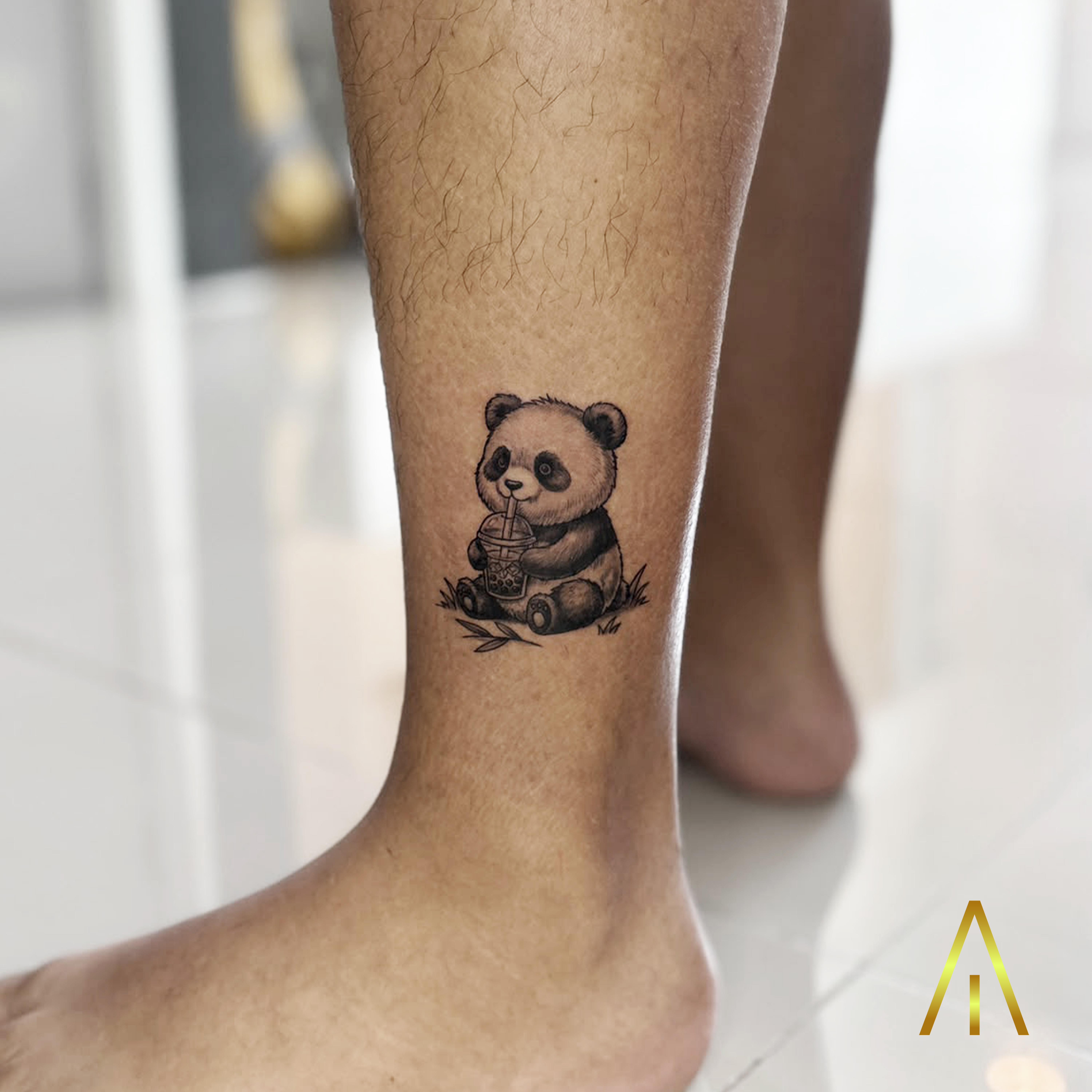 Mimi baby panda drinking bubble tea minimal shin tattoo Chiang Mai
