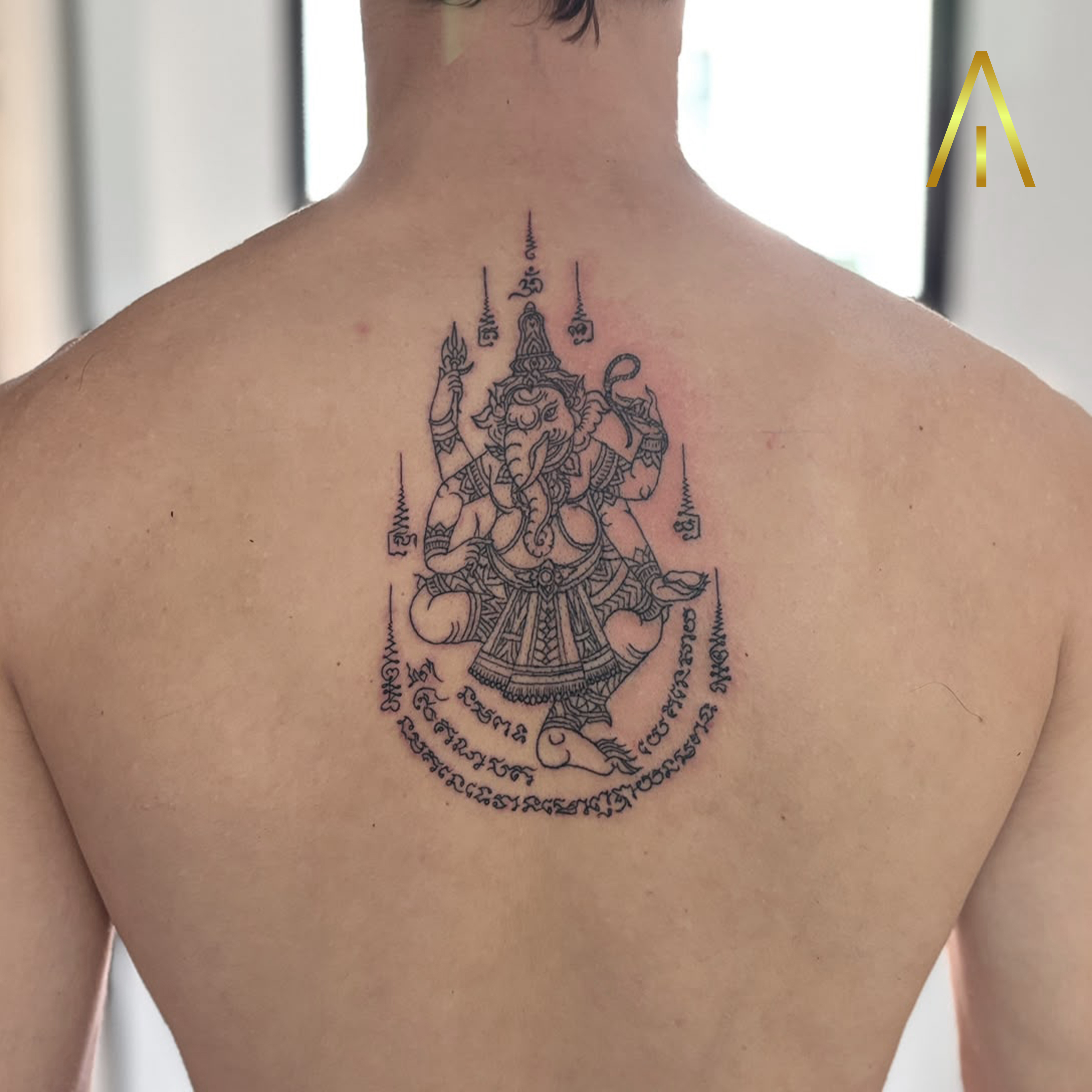Taely Sak Yant Ganesha upper back tattoo Chiang Mai